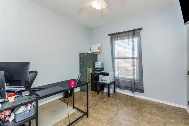 a workspace with furniture and a window