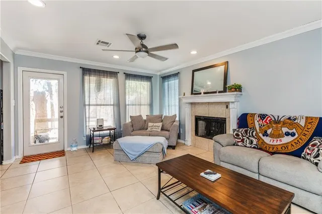 a living room with furniture and a fireplace