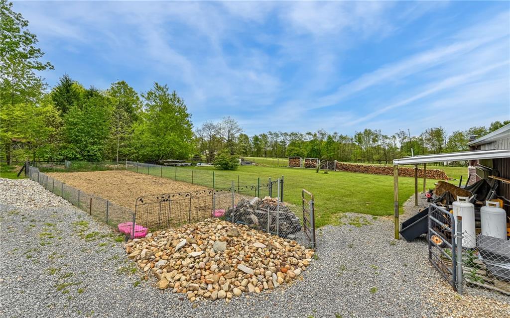 307 Hungarian Road Slippery Rock, PA 16057 - Photo 27 of 34 a view of a garden with an outdoor seating