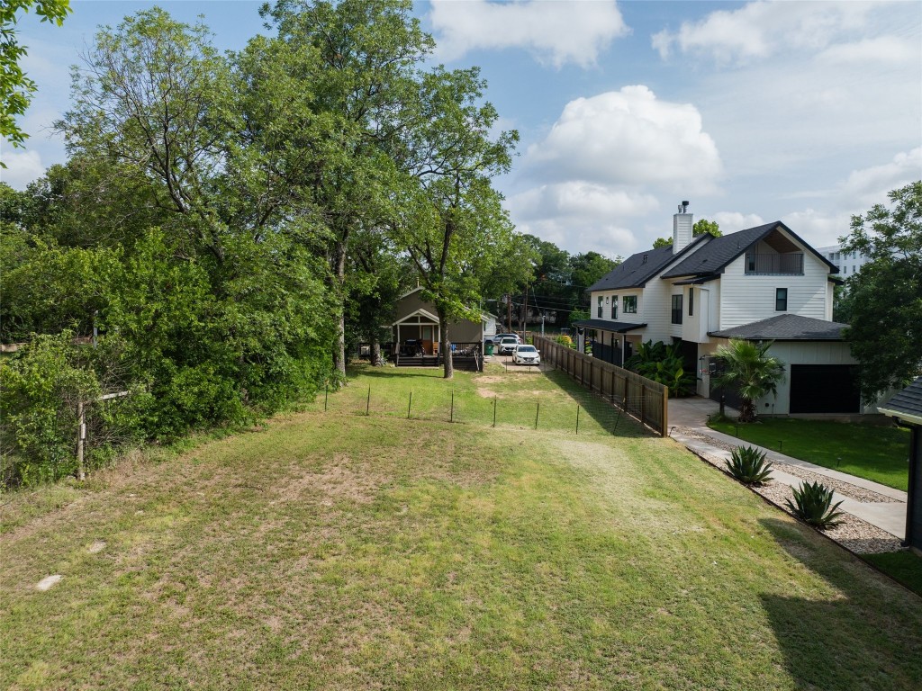 a view of a house with swimming pool and sitting area