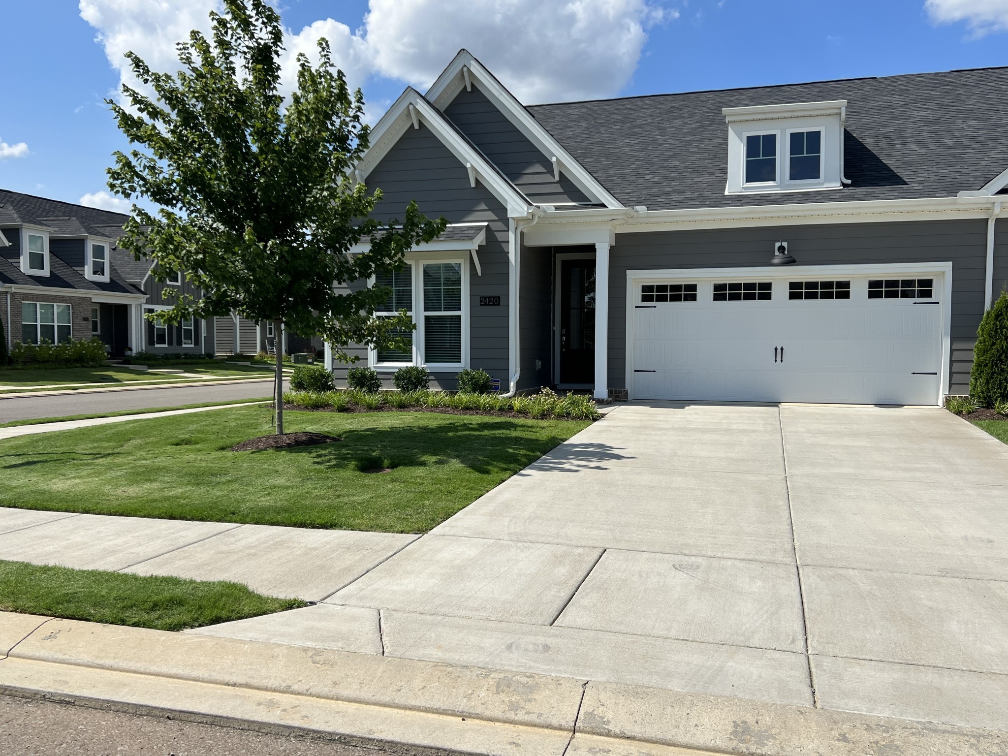 front view of a house with a yard
