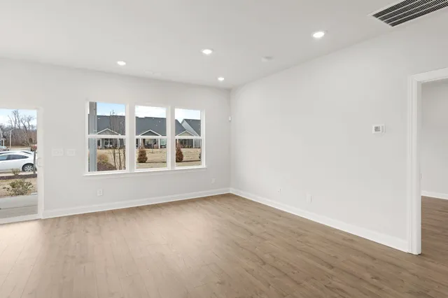 a view of an empty room with a window