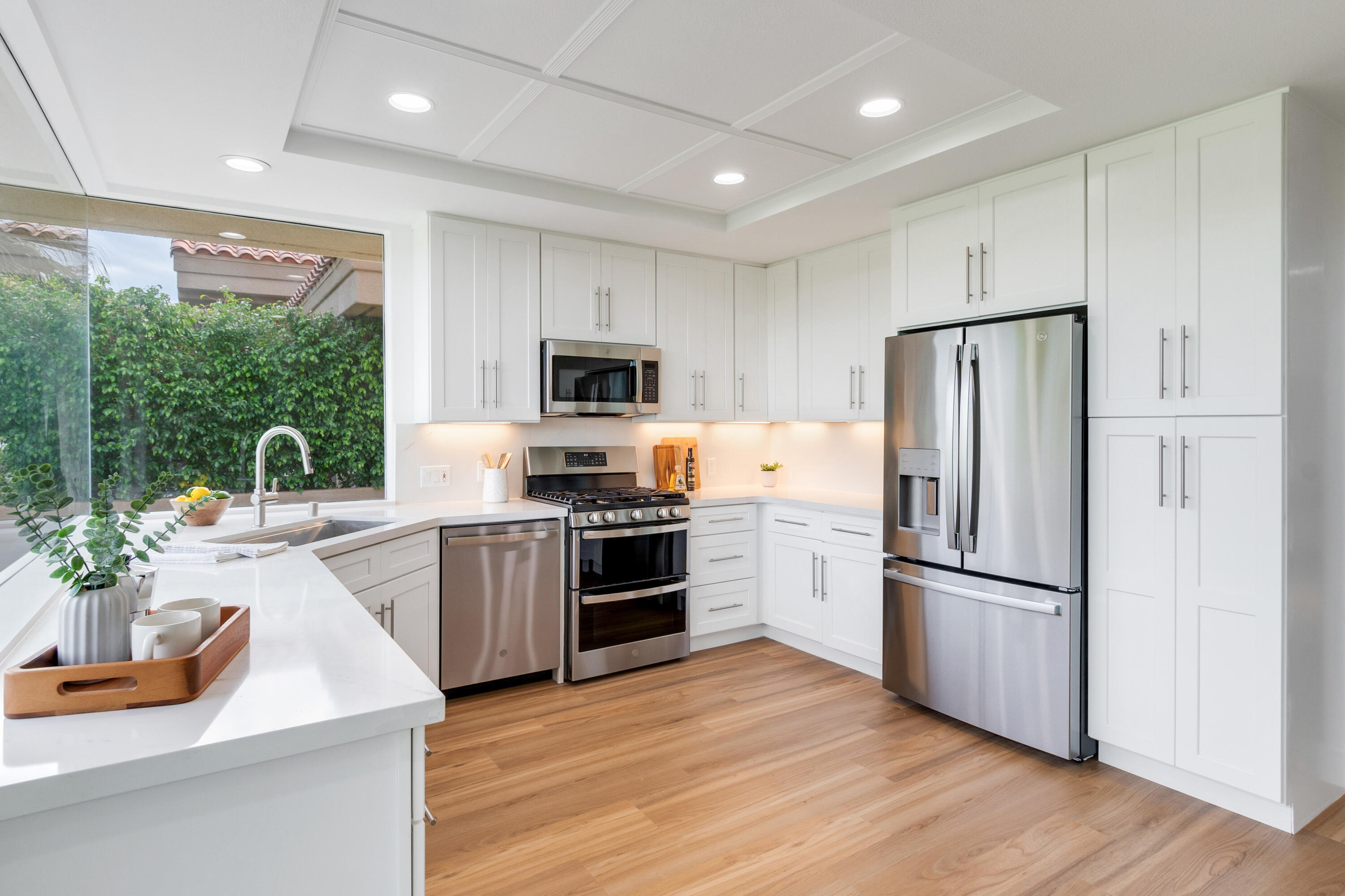 30 Hilton Head Drive Rancho Mirage, CA 92270 - Photo 11 of 33 a kitchen with a refrigerator stove top oven and sink
