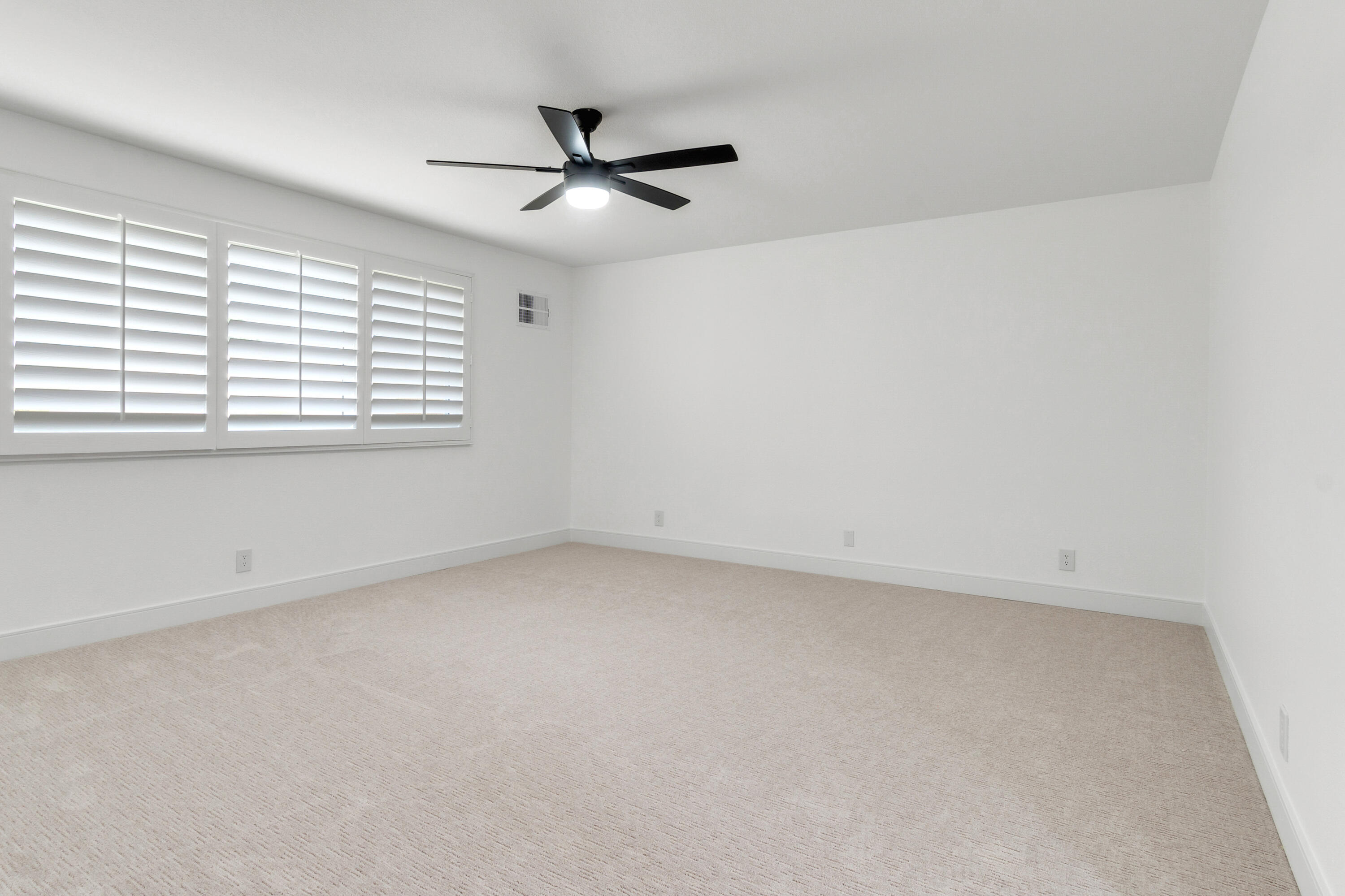 30 Hilton Head Drive Rancho Mirage, CA 92270 - Photo 17 of 33 an empty room with a window and a fan