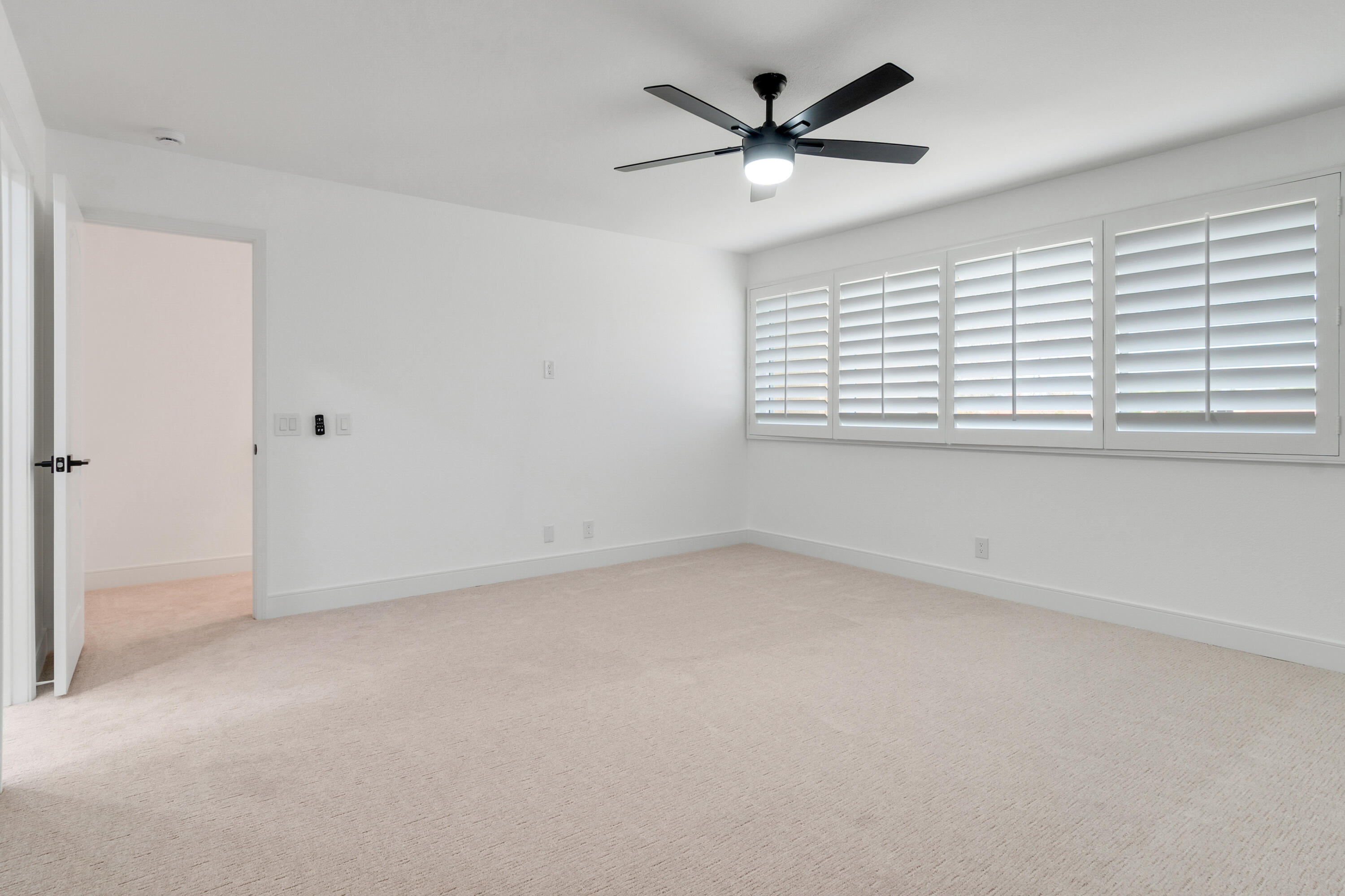 30 Hilton Head Drive Rancho Mirage, CA 92270 - Photo 18 of 33 an empty room with a window and a fan
