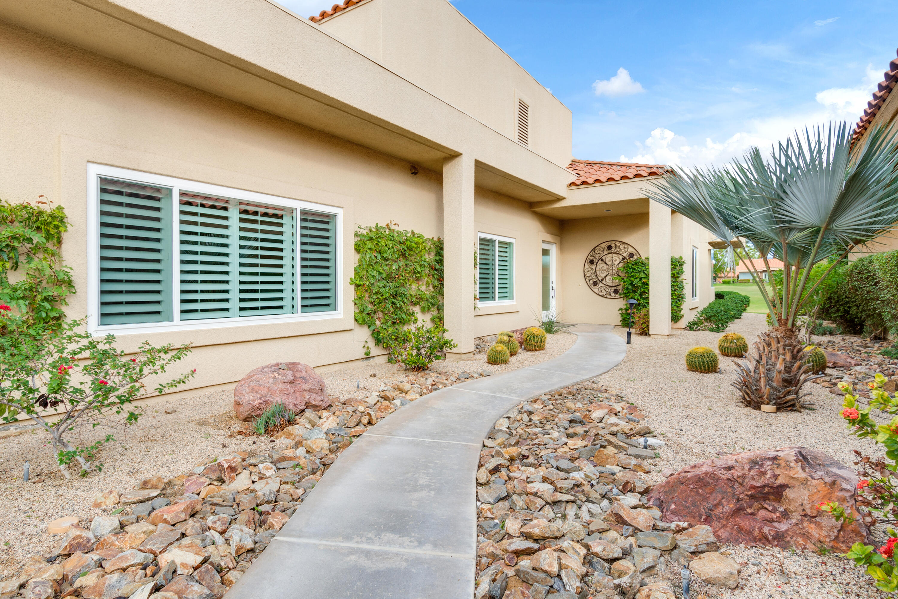 30 Hilton Head Drive Rancho Mirage, CA 92270 - Photo 23 of 33 a front view of a house with garden