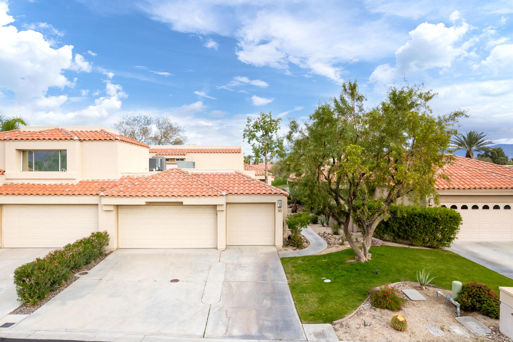 30 Hilton Head Drive Rancho Mirage, CA 92270 - Photo 25 of 33 a view of a house with a yard and potted plants