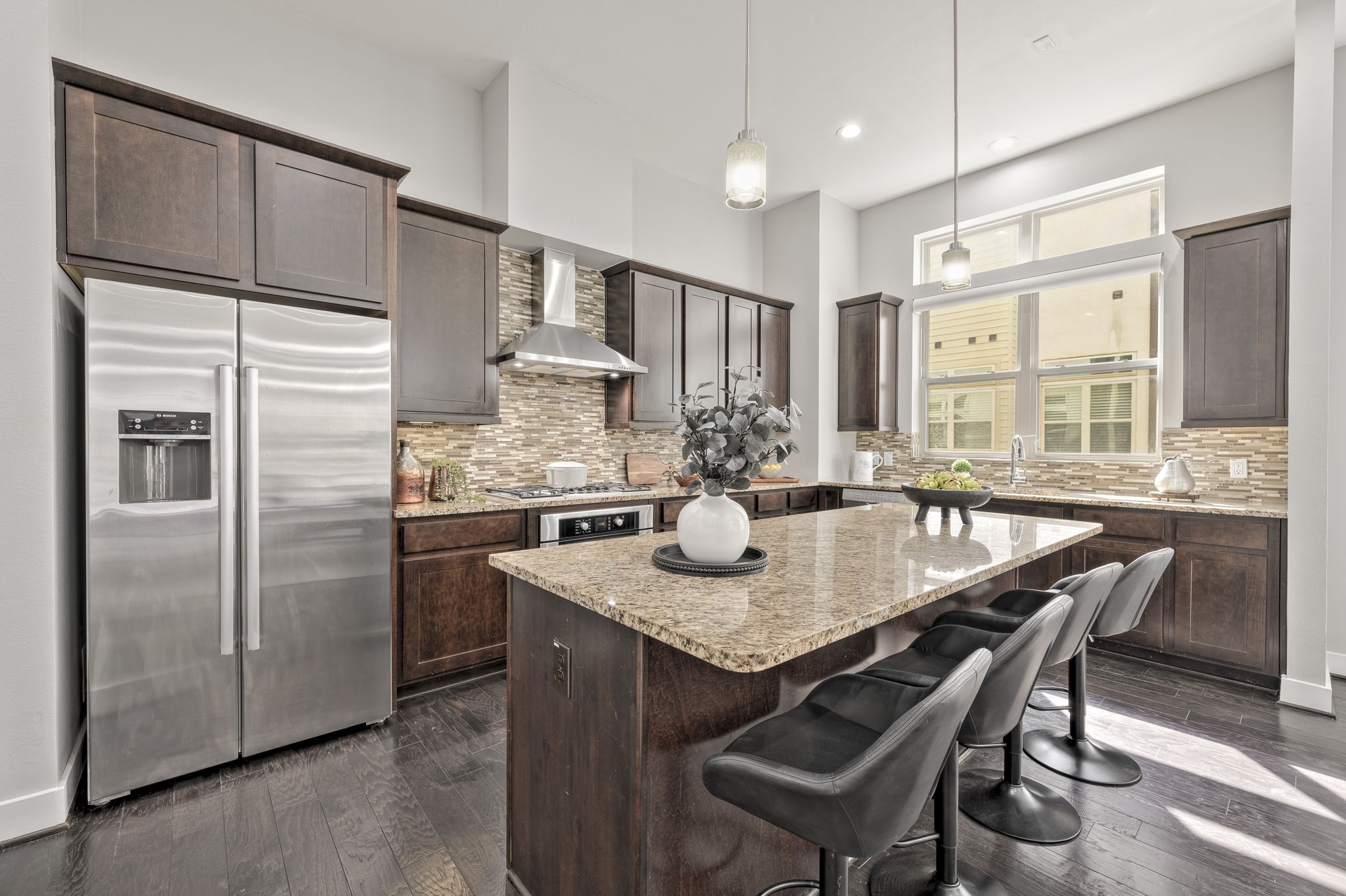 4408 Eli Street, Unit C Houston, TX 77007 - Photo 15 of 48 a kitchen with stainless steel appliances granite countertop a kitchen island hardwood floor and a sink