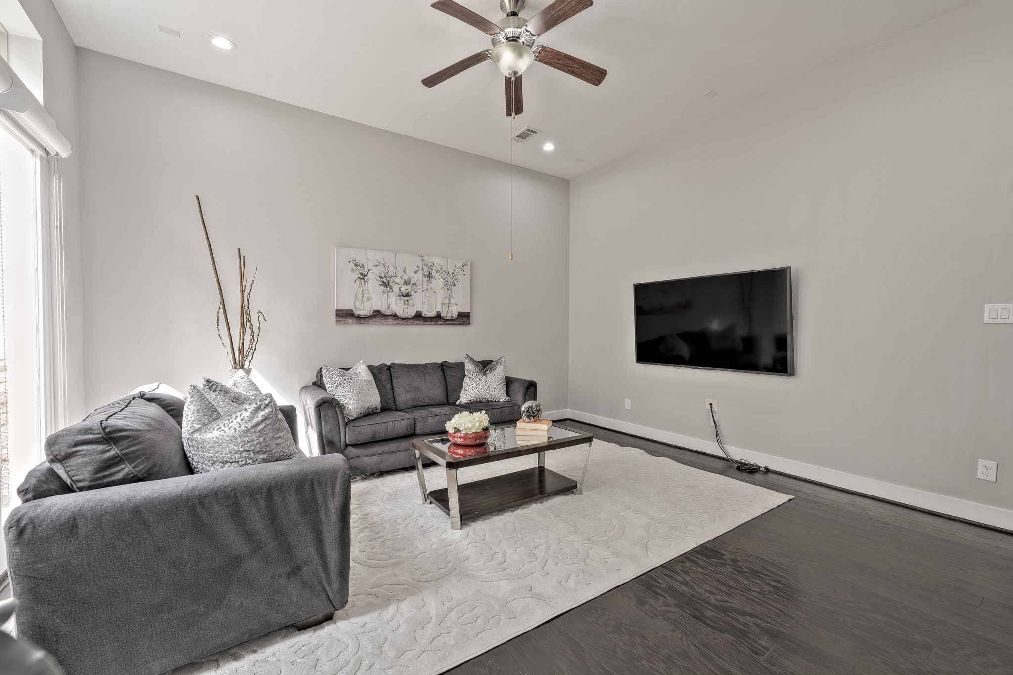 4408 Eli Street, Unit C Houston, TX 77007 - Photo 17 of 48 a living room with furniture and a flat screen tv
