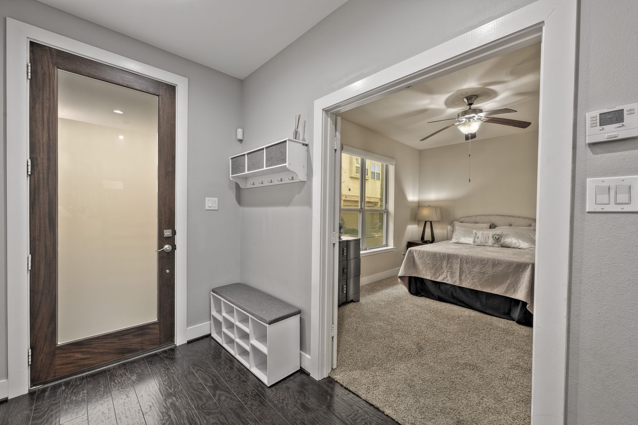 4408 Eli Street, Unit C Houston, TX 77007 - Photo 2 of 48 a spacious bedroom with a bed and a painting on the wall