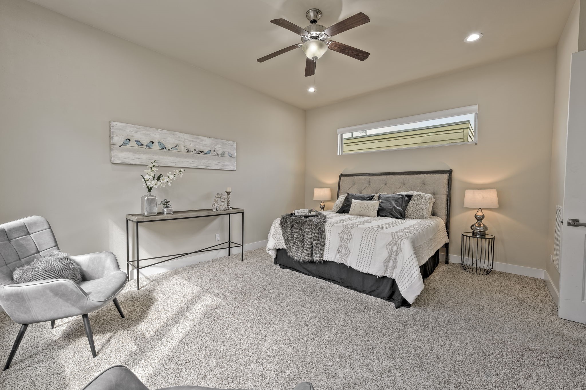 4408 Eli Street, Unit C Houston, TX 77007 - Photo 22 of 48 a bedroom with a bed and a chandelier