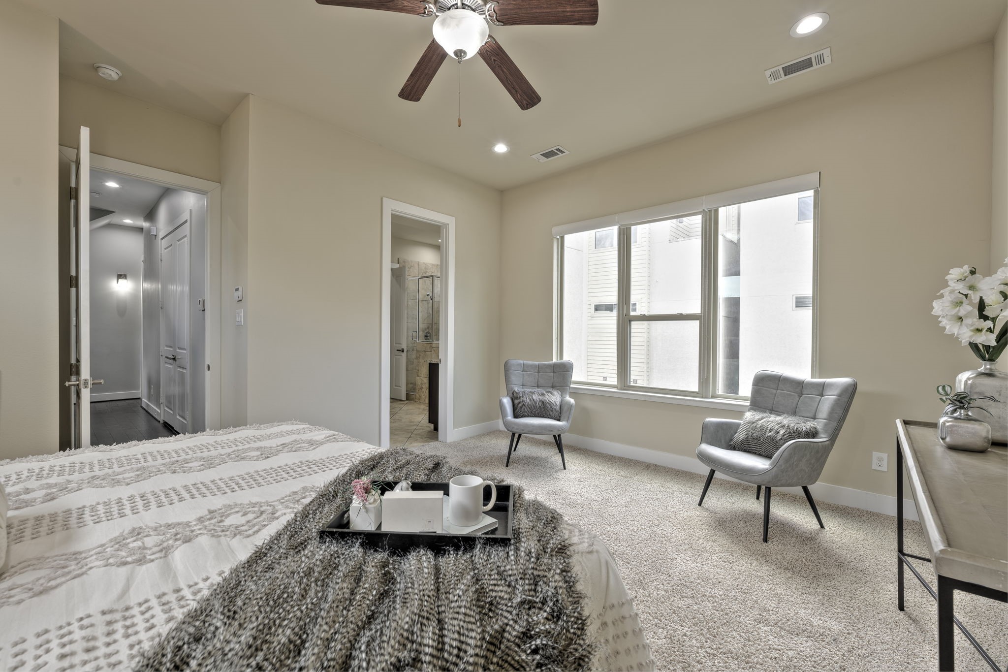 4408 Eli Street, Unit C Houston, TX 77007 - Photo 23 of 48 a spacious bedroom with a bed and a chandelier