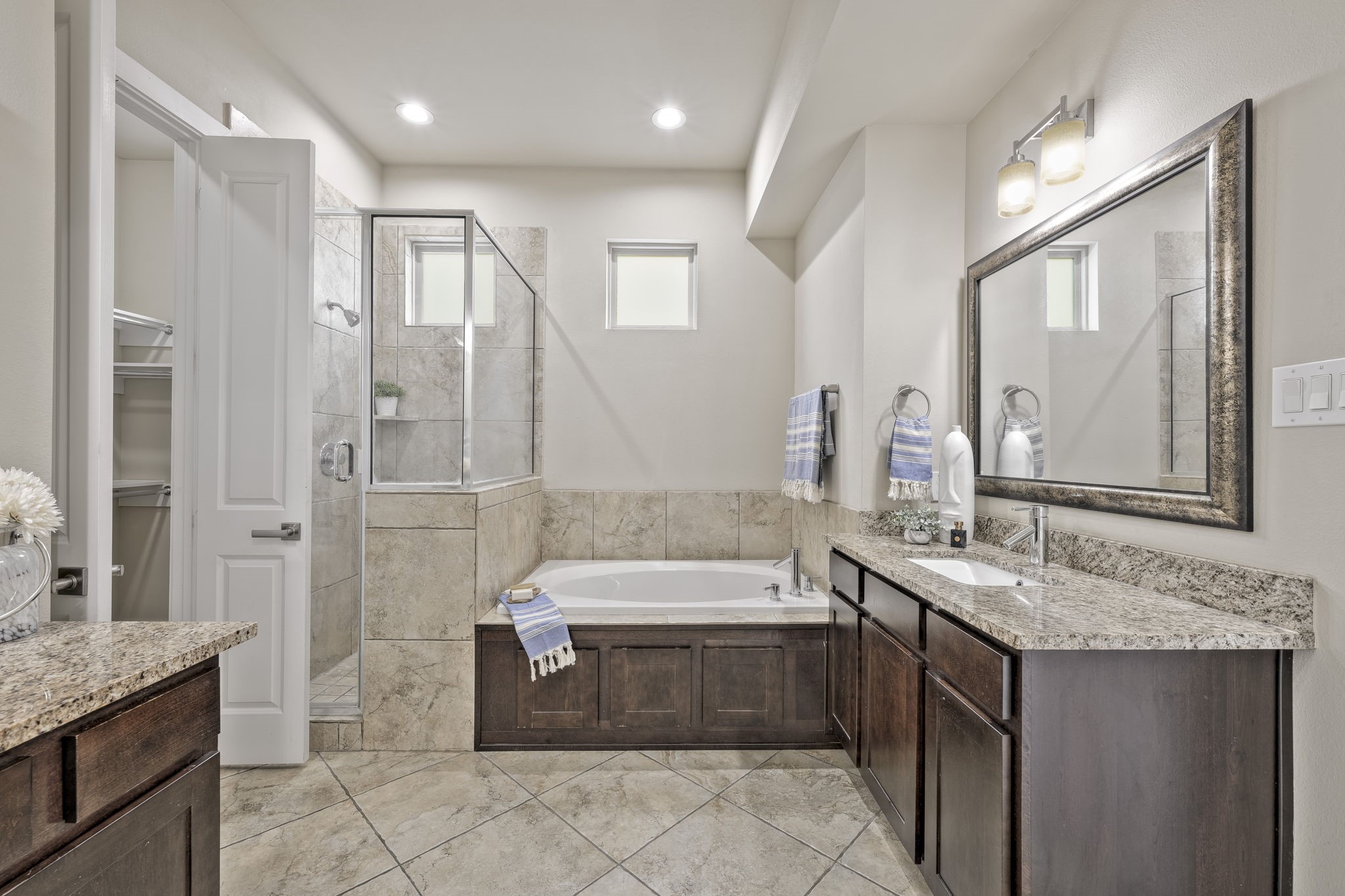 4408 Eli Street, Unit C Houston, TX 77007 - Photo 24 of 48 a bathroom with a granite countertop bathtub sink vanity and mirror