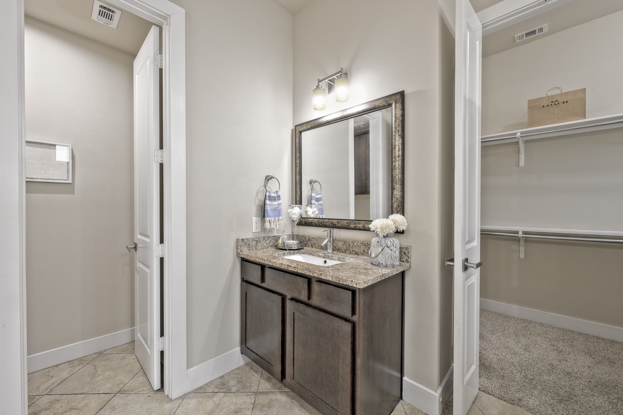 4408 Eli Street, Unit C Houston, TX 77007 - Photo 25 of 48 a bathroom with a granite countertop sink and a mirror