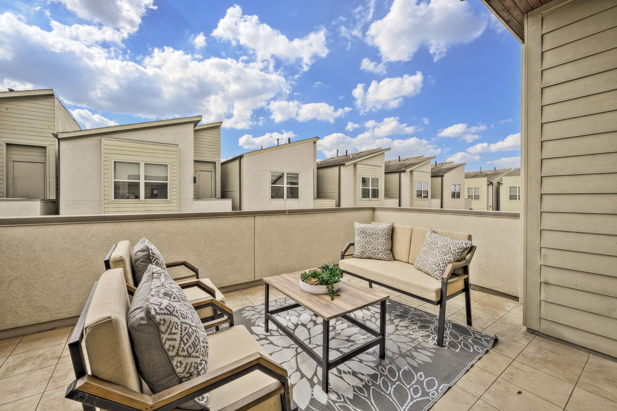 4408 Eli Street, Unit C Houston, TX 77007 - Photo 31 of 48 a view of a patio with couches table and chairs and potted plants