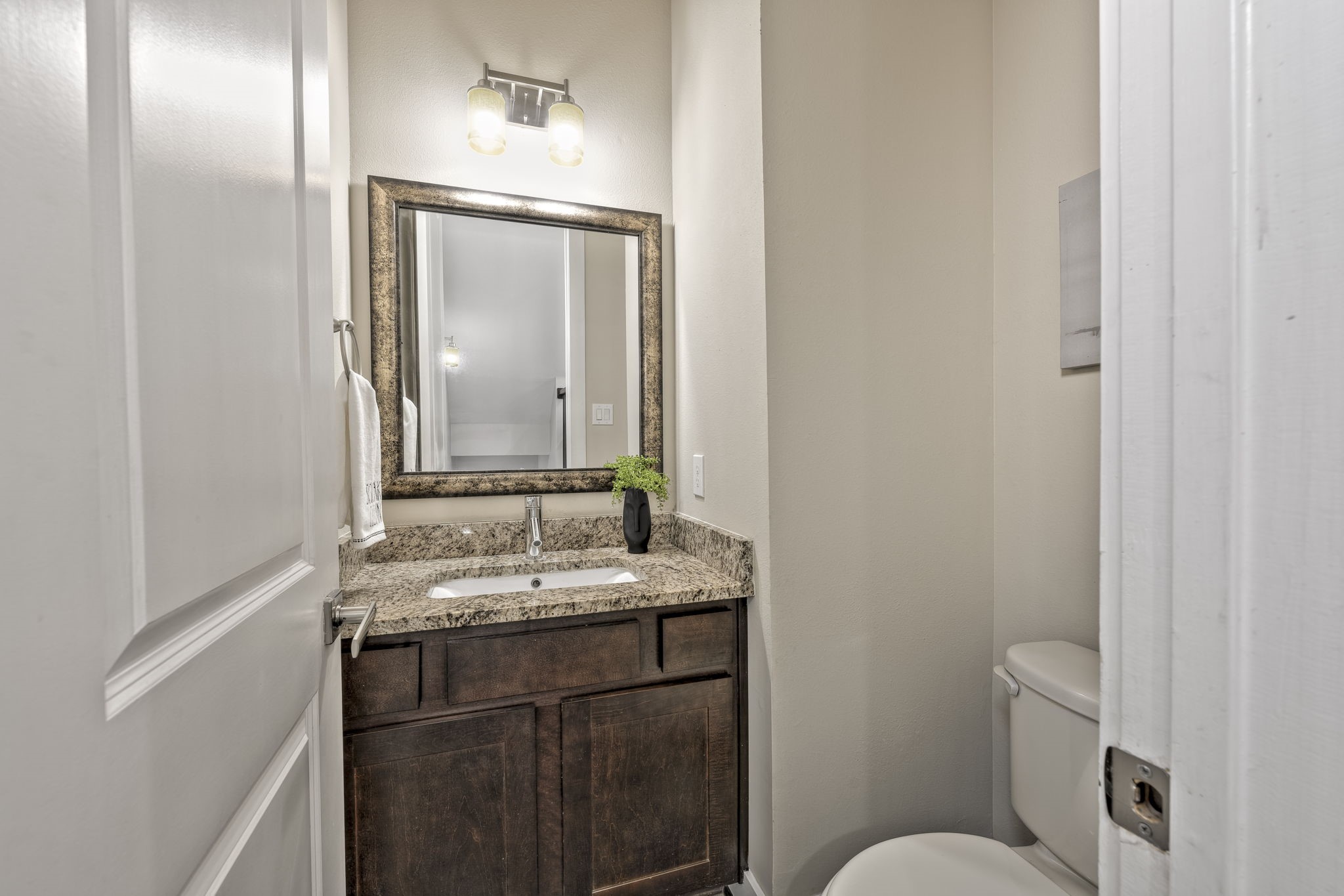 4408 Eli Street, Unit C Houston, TX 77007 - Photo 8 of 48 a bathroom with a granite countertop sink toilet and mirror