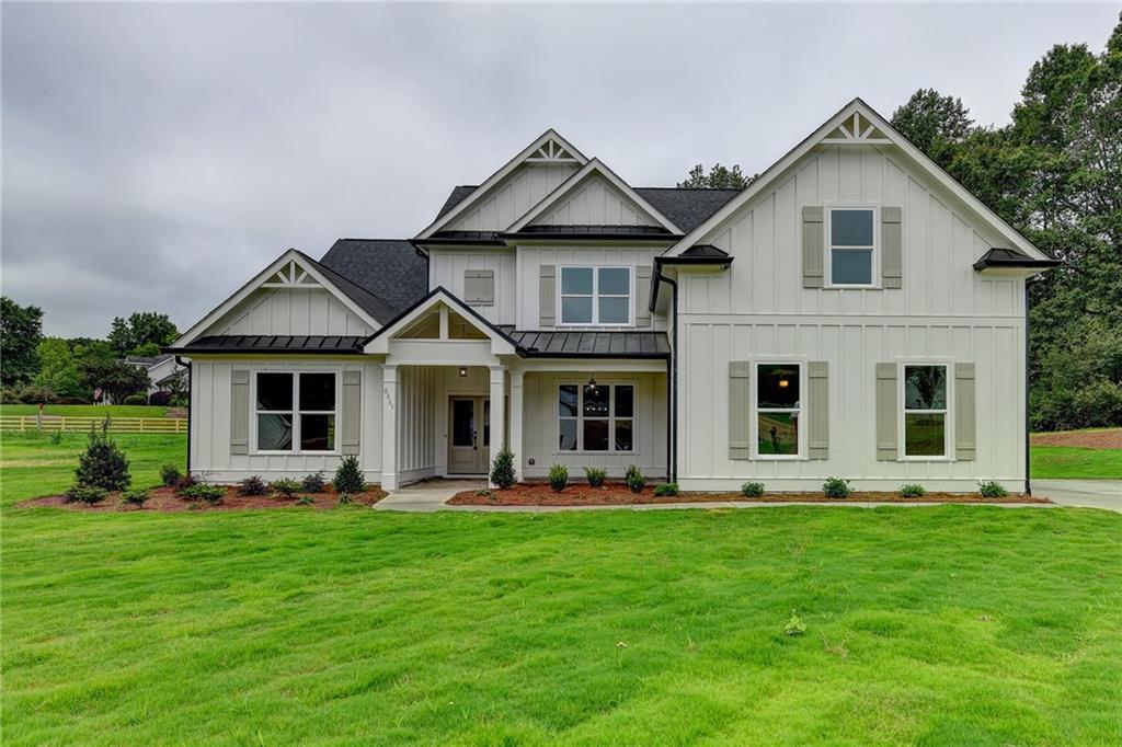 a front view of house with yard and green space