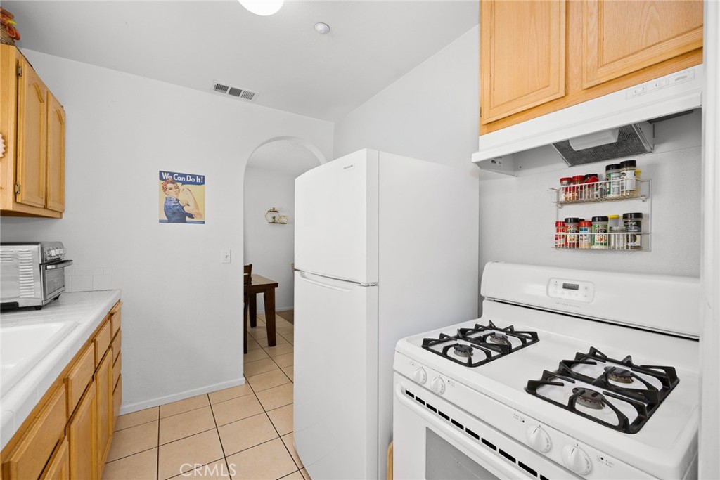 2306 Alhambra Road Alhambra, CA 91801 - Photo 18 of 29 a kitchen with a refrigerator and a stove top oven