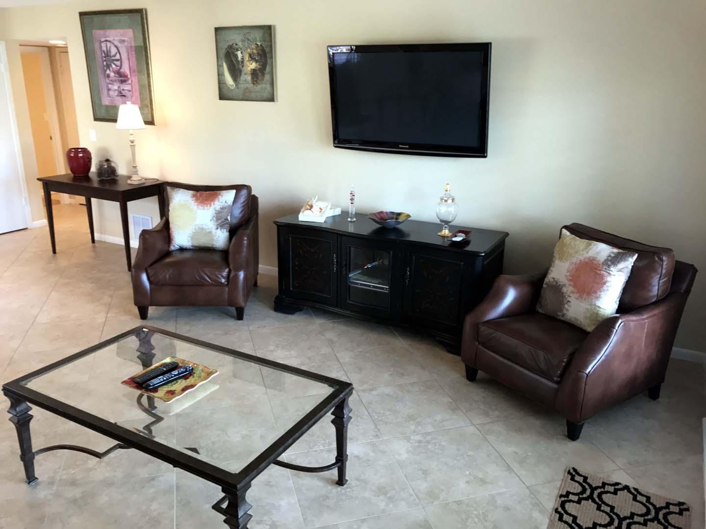 5073 Beachwalk Way Miramar Beach, FL 32550 - Photo 18 of 61 a living room with furniture and a flat screen tv