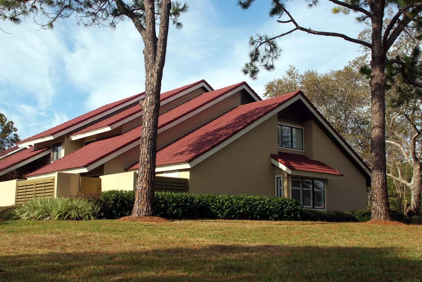 5073 Beachwalk Way Miramar Beach, FL 32550 - Photo 2 of 61 a front view of house with yard and trees