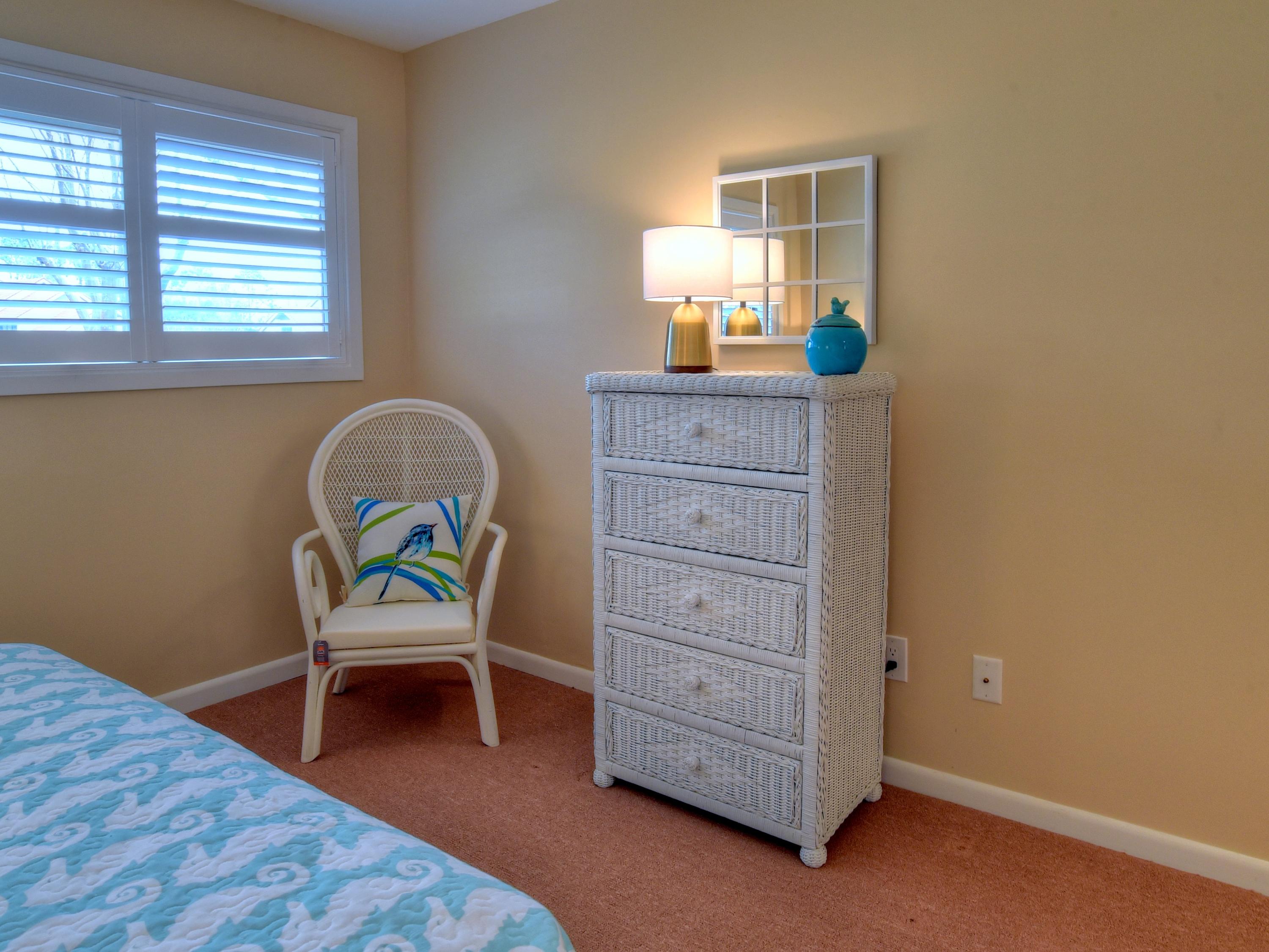 5073 Beachwalk Way Miramar Beach, FL 32550 - Photo 23 of 61 a room with a chair and a dresser