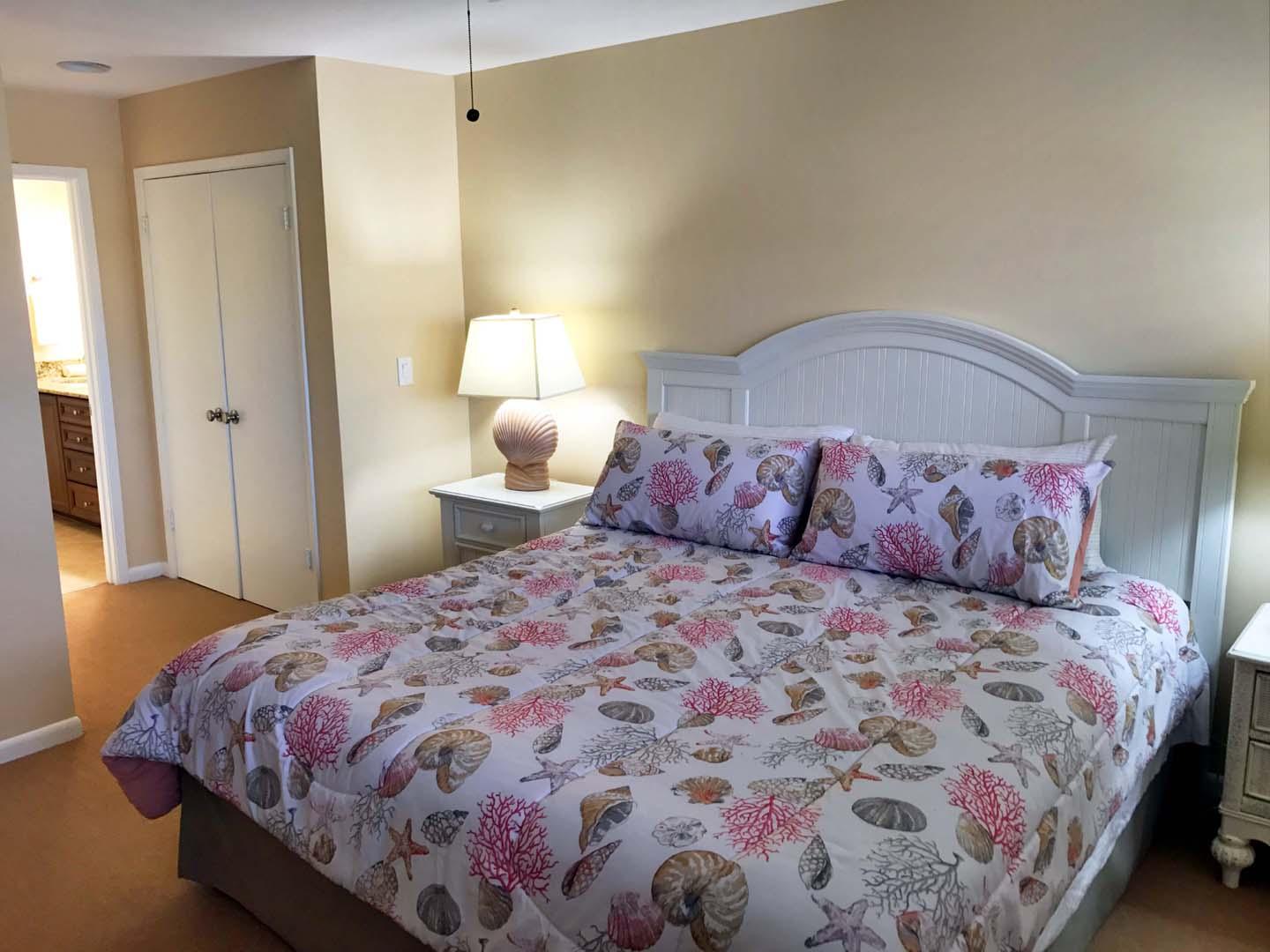 5073 Beachwalk Way Miramar Beach, FL 32550 - Photo 40 of 61 a bedroom with a mirror and a bed