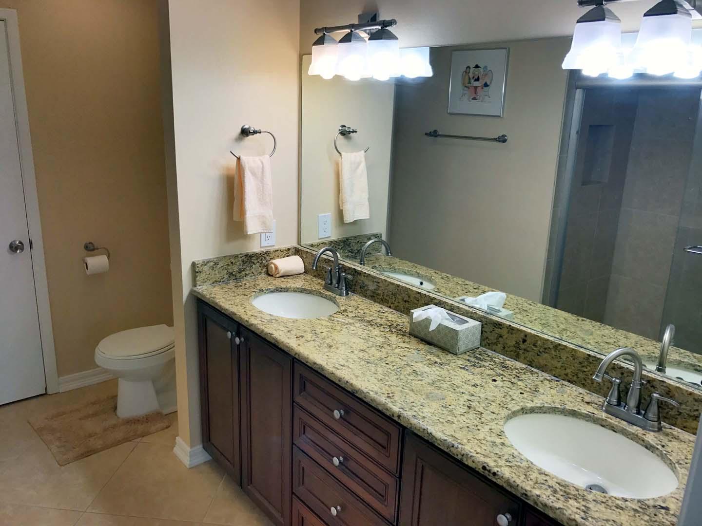 5073 Beachwalk Way Miramar Beach, FL 32550 - Photo 43 of 61 a bathroom with a granite countertop double vanity sink and a mirror