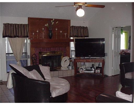 4217 Nicklaus Lane Corpus Christi, TX 78413 - Photo 2 of 7 a living room with furniture and a flat screen tv