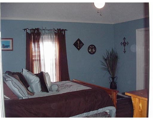 4217 Nicklaus Lane Corpus Christi, TX 78413 - Photo 4 of 7 a bedroom with a bed and a window