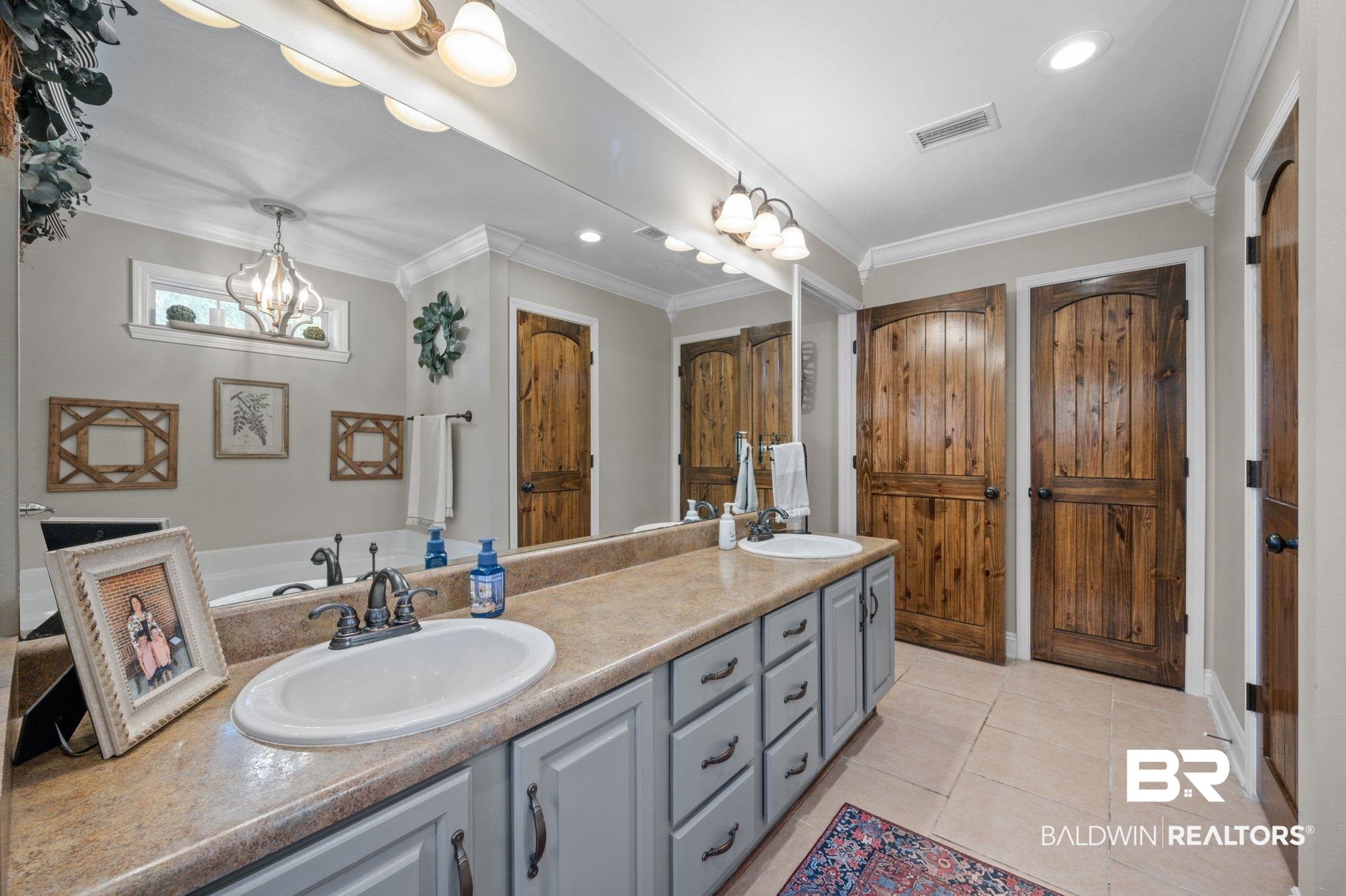 38211-d) V R Byrd Road Bay Minette, AL 36507 - Photo 20 of 58 Bathroom featuring tile patterned flooring, vanity, a chandelier, and crown molding