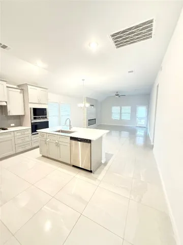 en empty room with fan and window