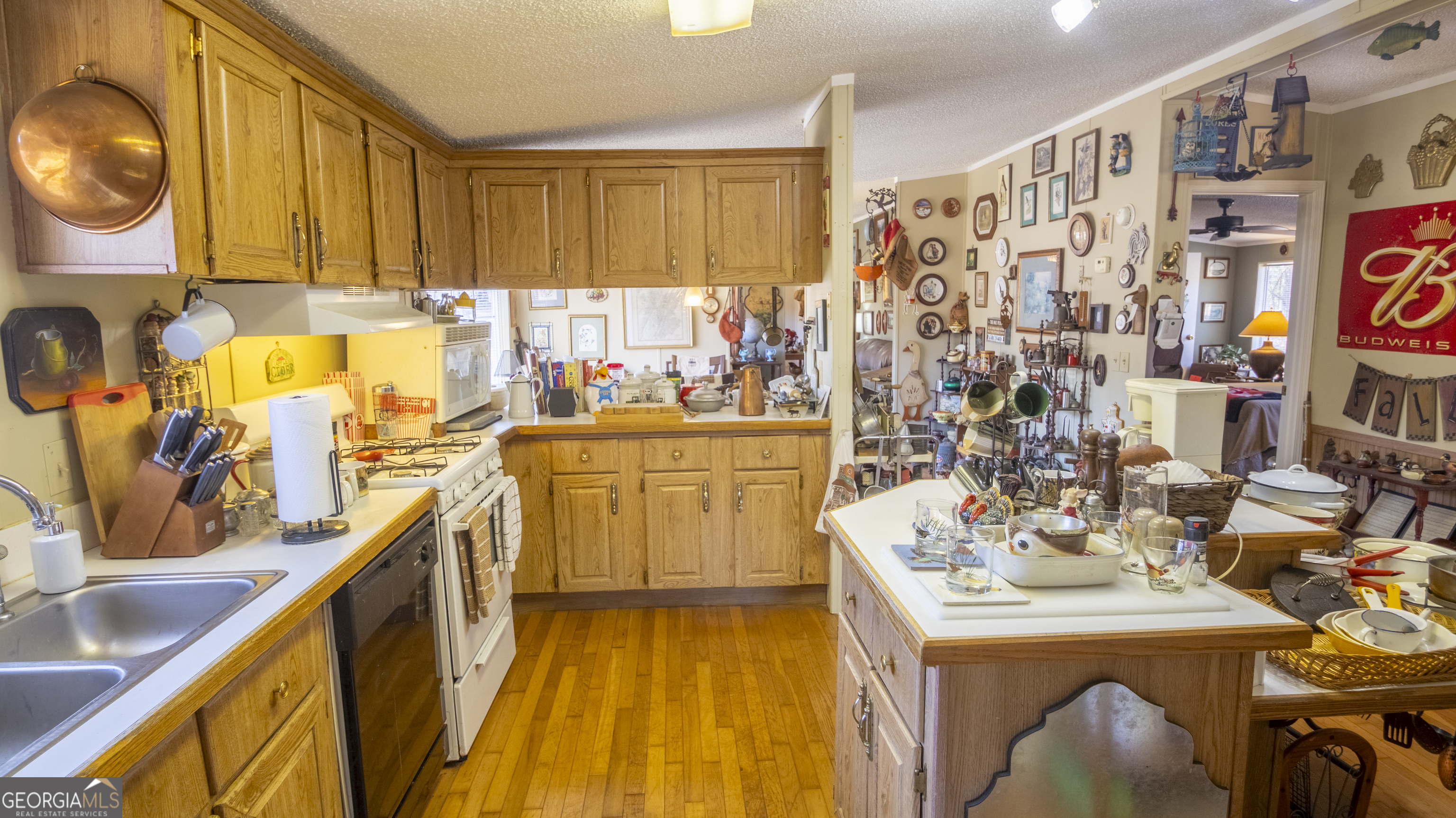 2717 Mount Pilgrim Road Greenville, GA 30222 - Photo 11 of 65 a view of a kitchen with a sink a washer and dryer