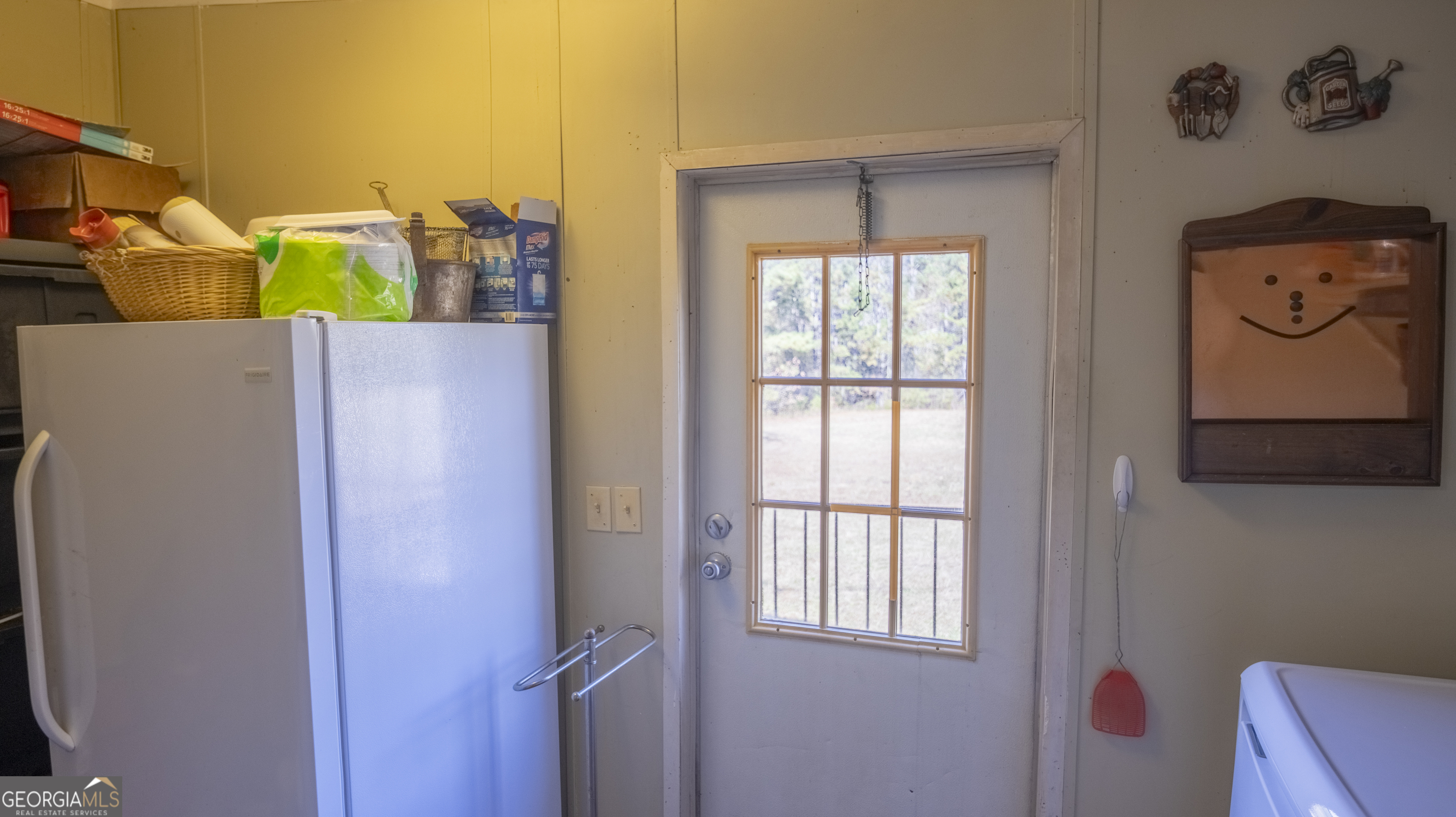 2717 Mount Pilgrim Road Greenville, GA 30222 - Photo 14 of 65 a view of a closet area with painted walls
