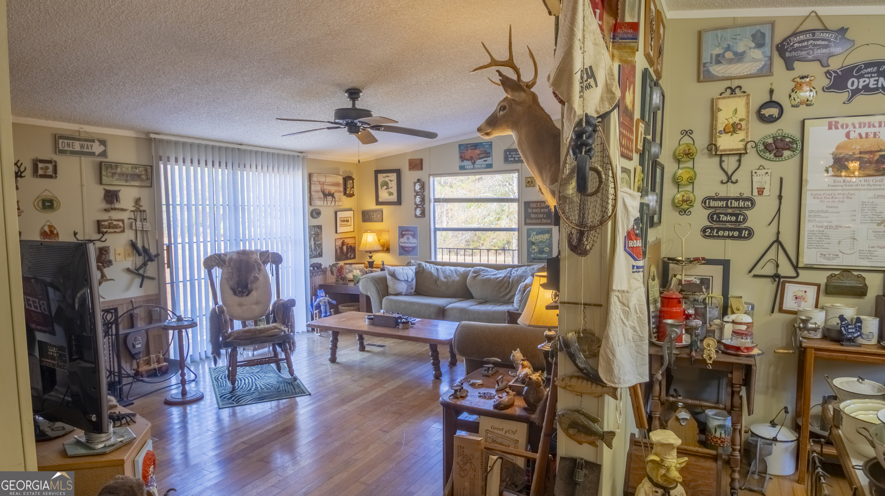2717 Mount Pilgrim Road Greenville, GA 30222 - Photo 15 of 65 a living room filled with furniture and a fireplace