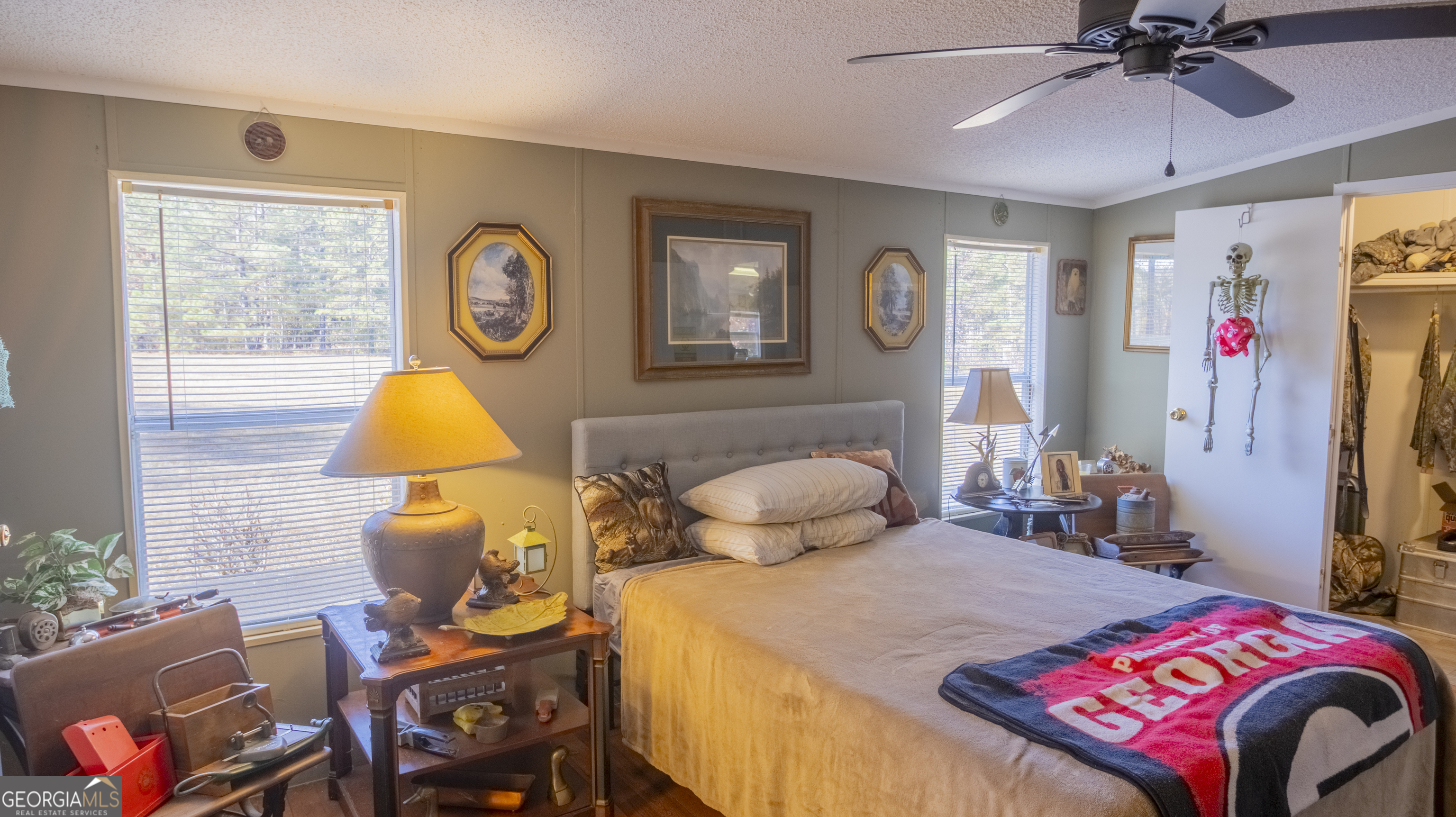 2717 Mount Pilgrim Road Greenville, GA 30222 - Photo 22 of 65 a bedroom with a bed and a lamp on dresser