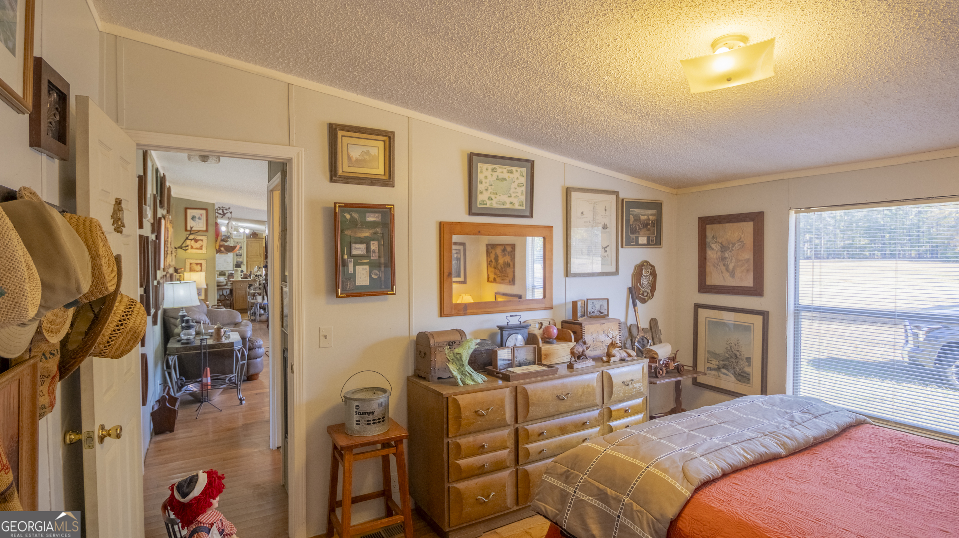 2717 Mount Pilgrim Road Greenville, GA 30222 - Photo 32 of 65 a bedroom with a bed and wooden floor