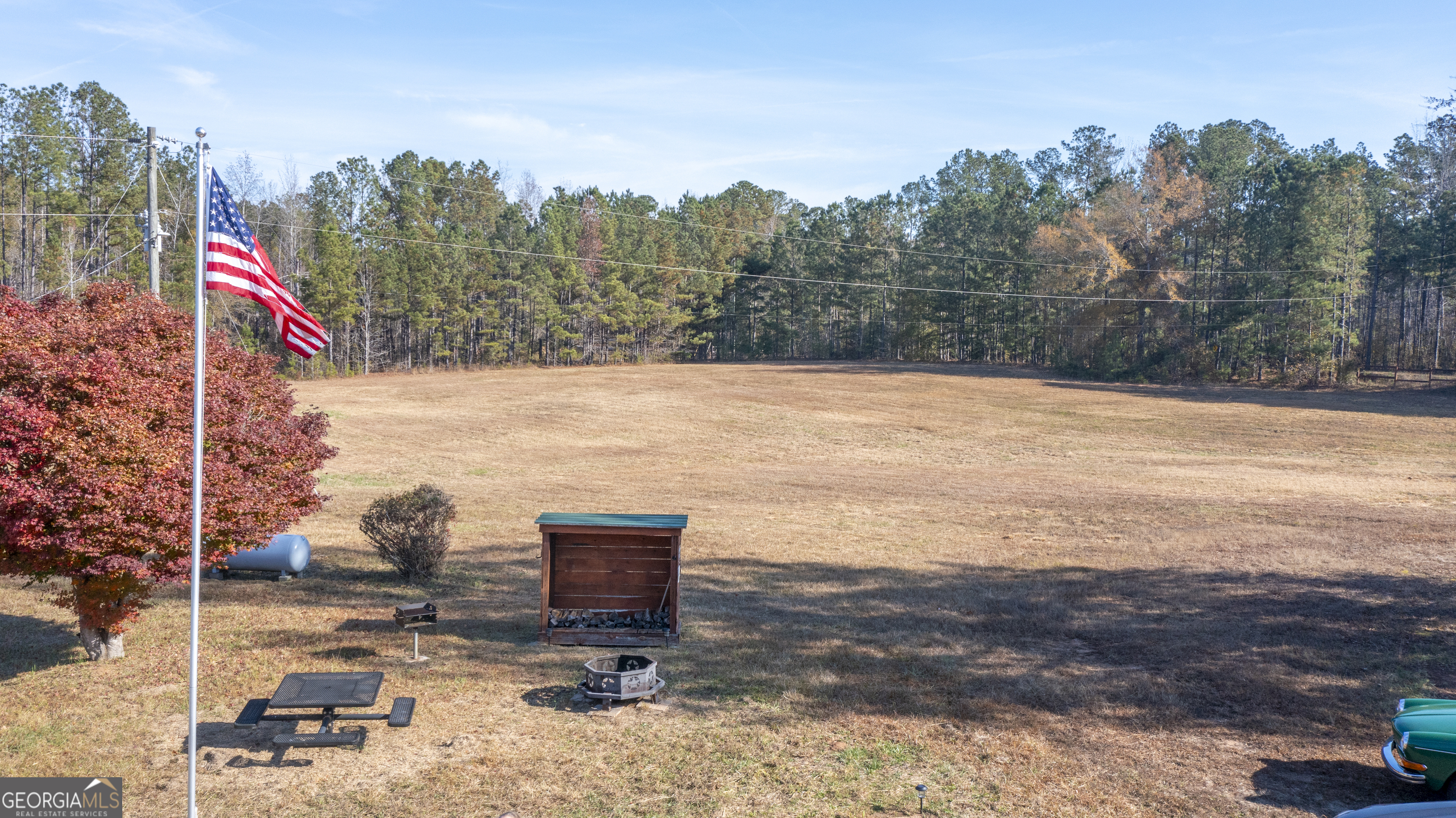 2717 Mount Pilgrim Road Greenville, GA 30222 - Photo 41 of 65 a view of a lake with a bench in the background