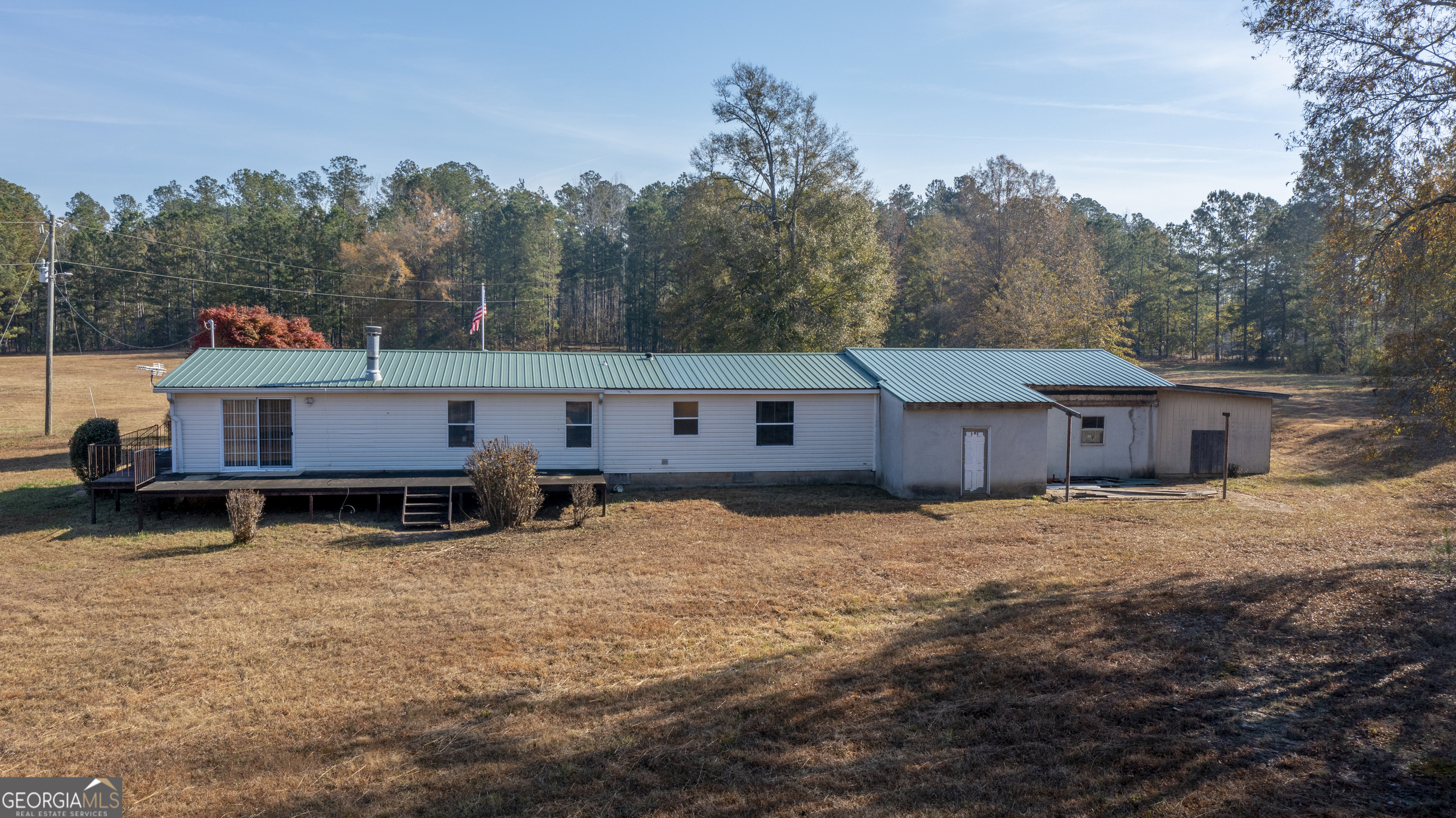 2717 Mount Pilgrim Road Greenville, GA 30222 - Photo 45 of 65 a view of a house with a yard covered in snow