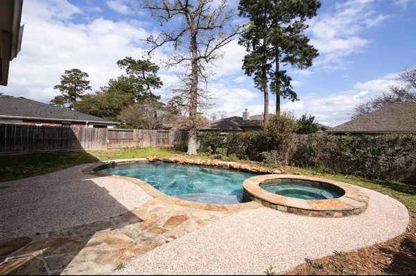 a view of swimming pool with a yard
