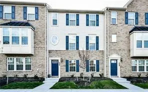 a view of a brick building with many windows