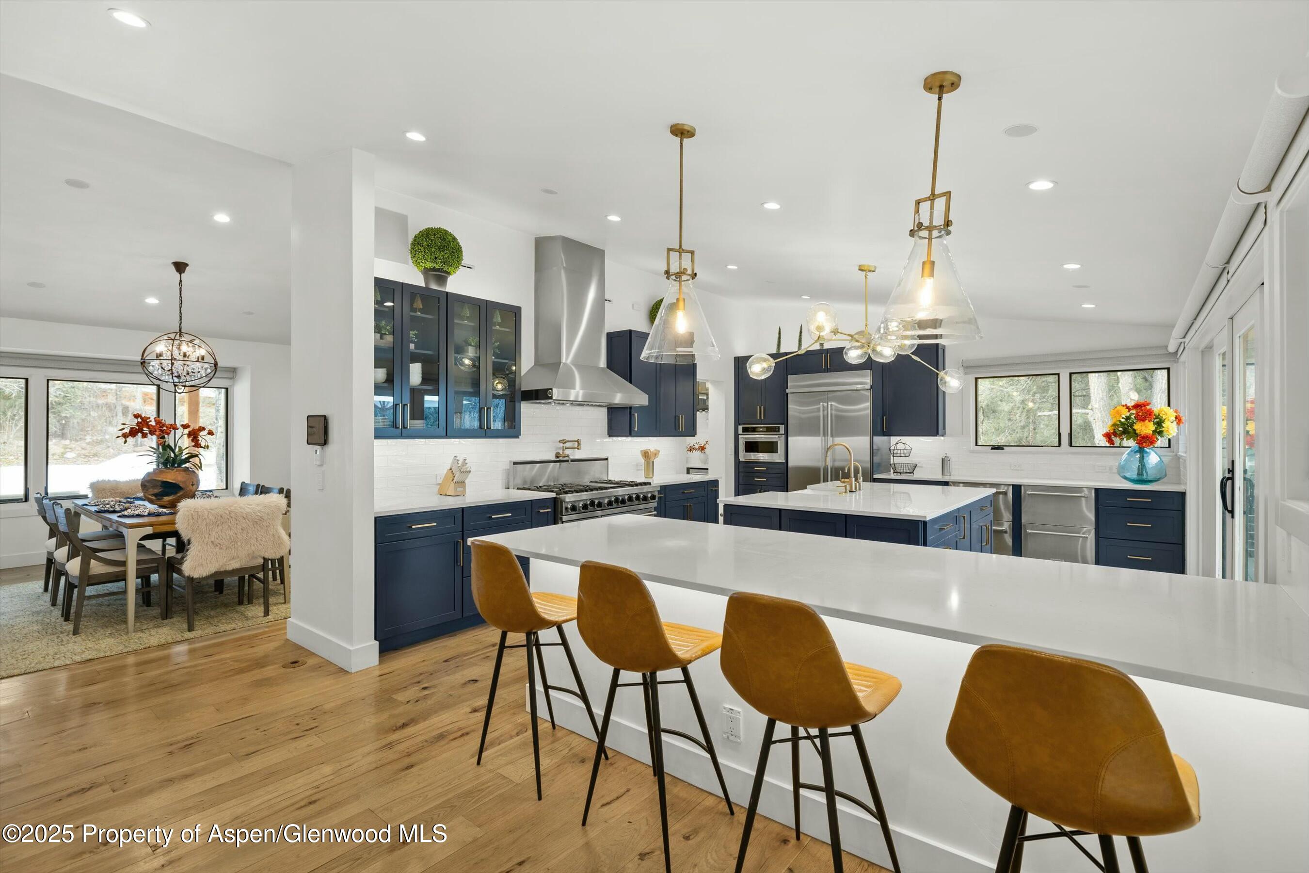 1631 Emma Spur Basalt, CO 81621 - Photo 11 of 52 a large kitchen with a table and chairs