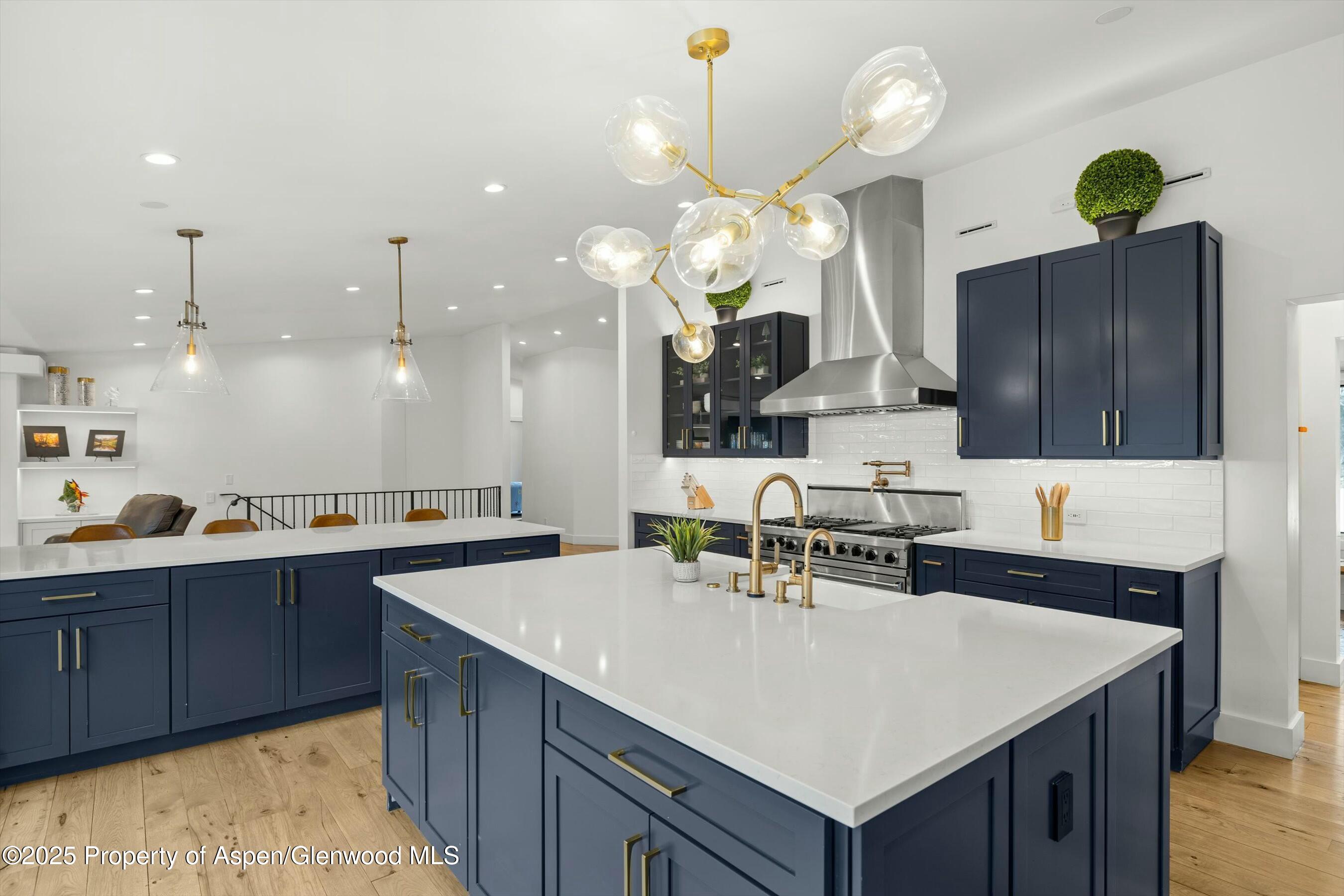 1631 Emma Spur Basalt, CO 81621 - Photo 13 of 52 a kitchen with a sink a counter space appliances and cabinets