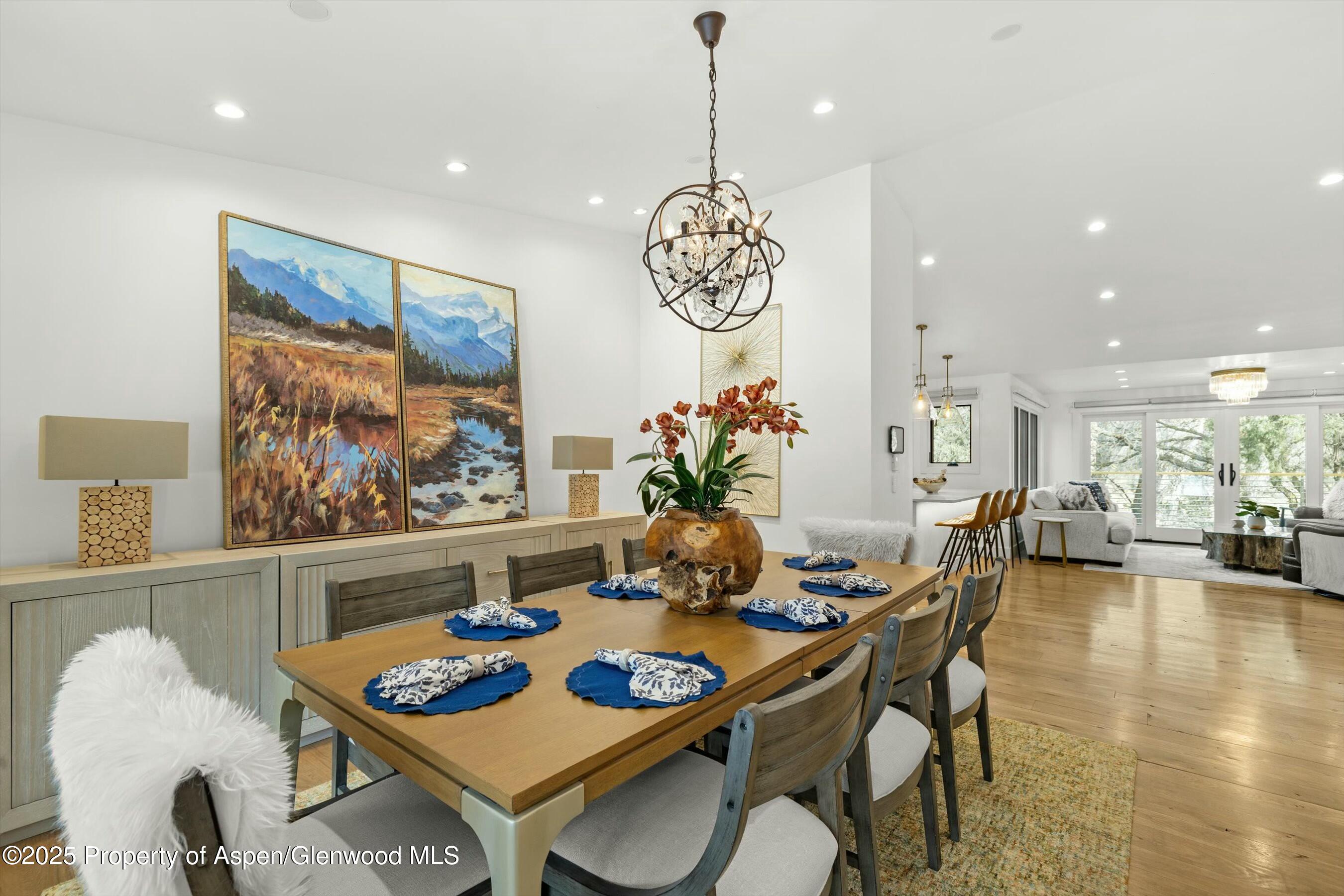 1631 Emma Spur Basalt, CO 81621 - Photo 18 of 52 a view of a dining room with furniture and wooden floor