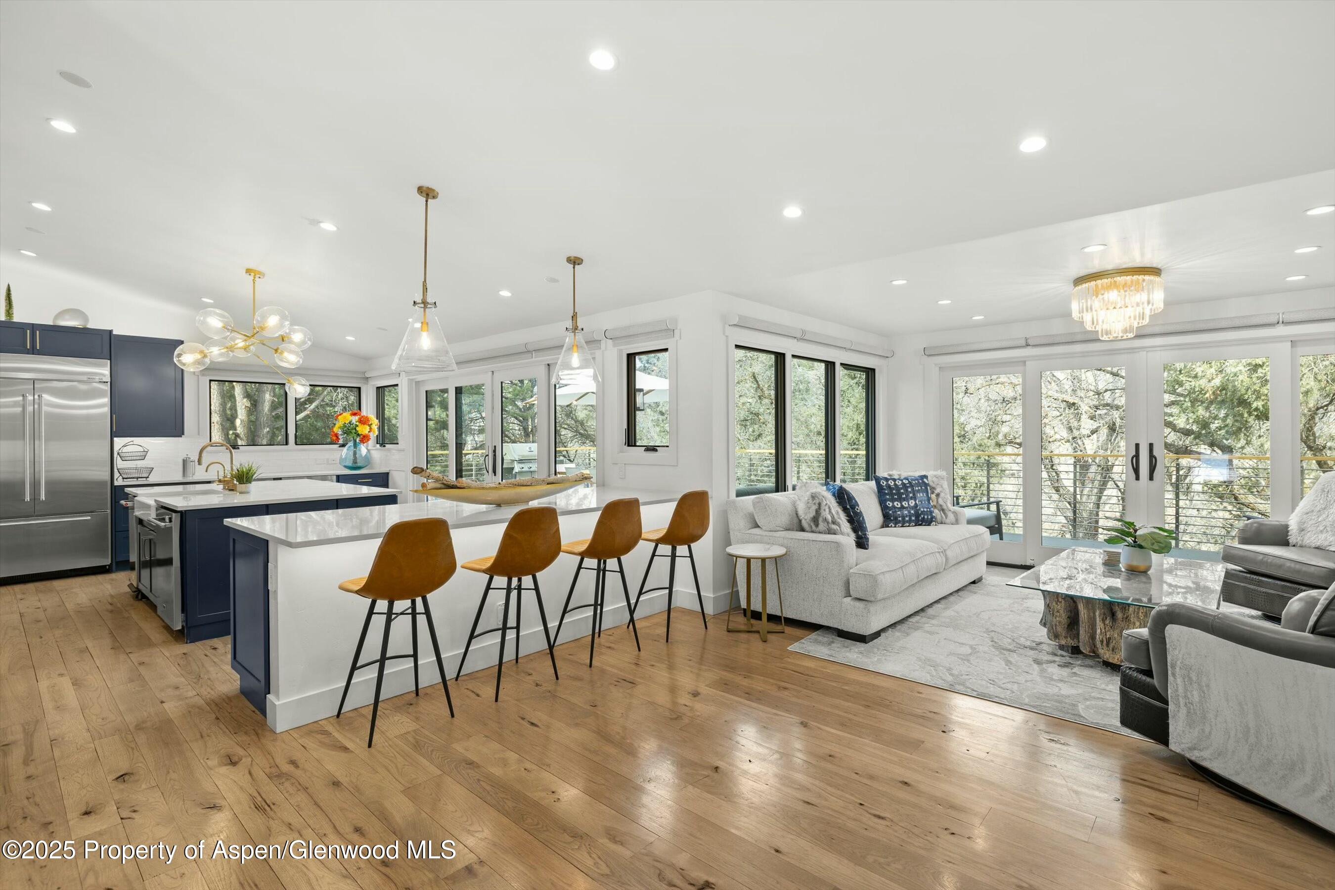 1631 Emma Spur Basalt, CO 81621 - Photo 19 of 52 a living room with lots of furniture and a large window