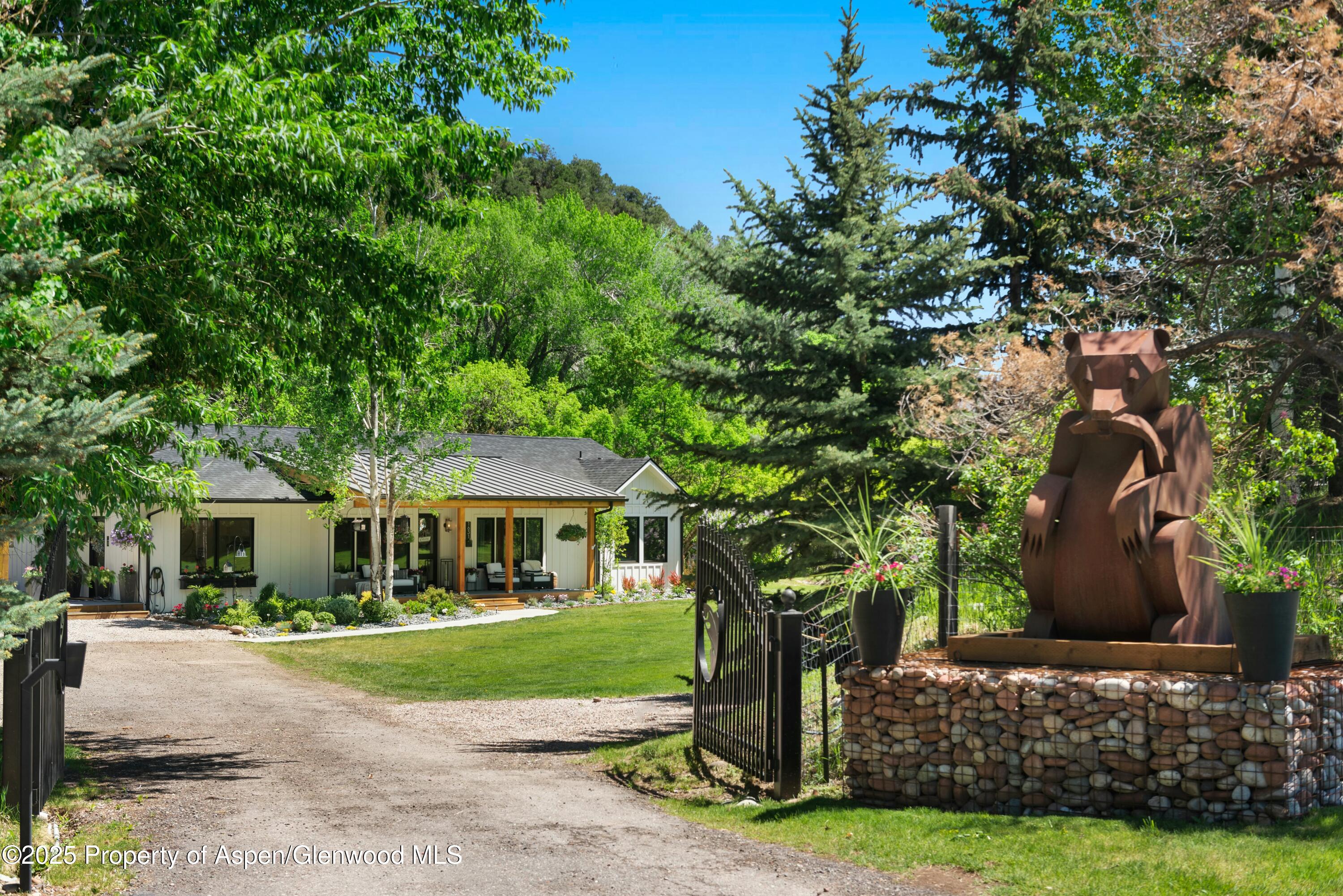 1631 Emma Spur Basalt, CO 81621 - Photo 2 of 52 a front view of a house with a yard