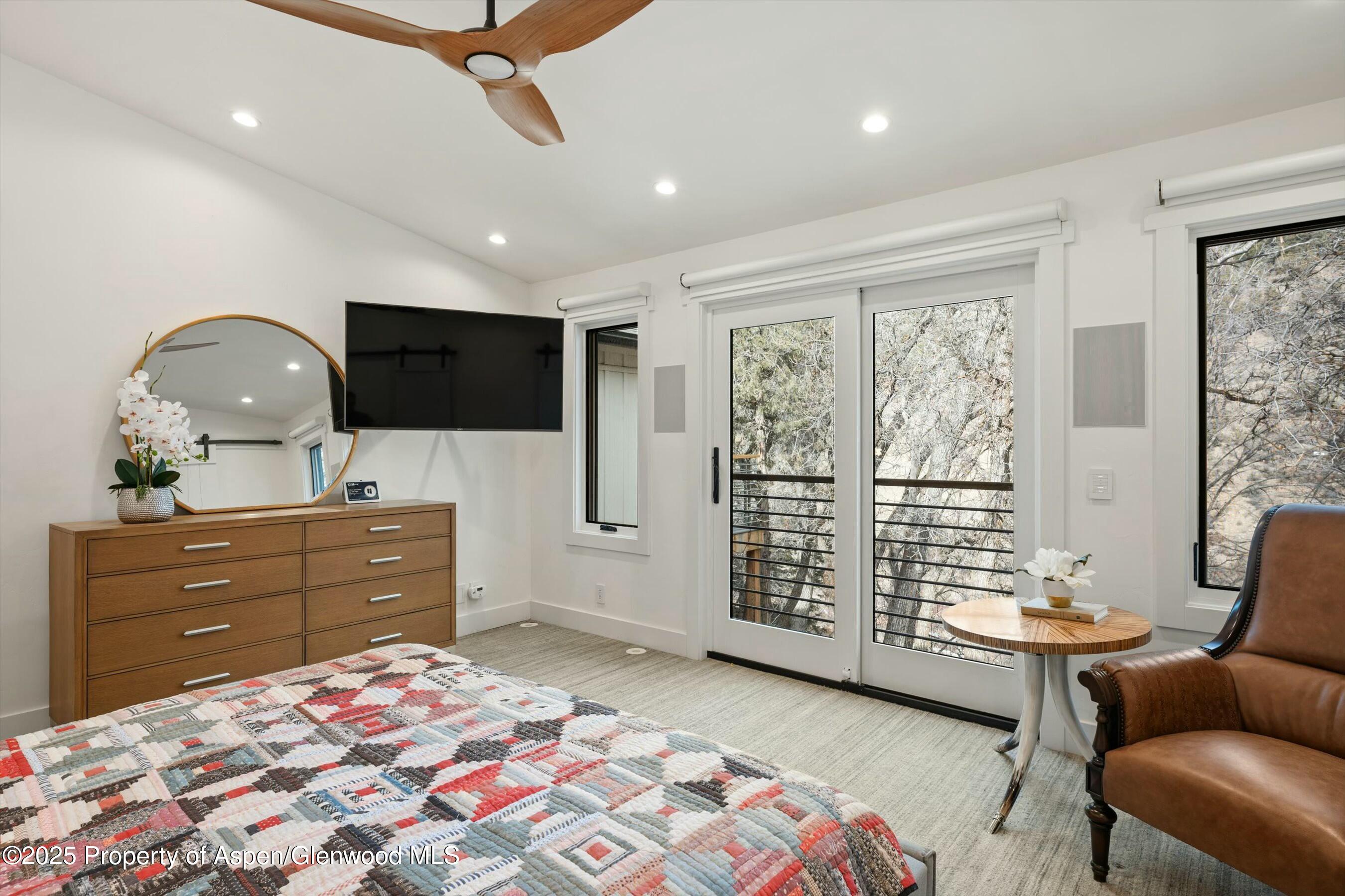 1631 Emma Spur Basalt, CO 81621 - Photo 23 of 52 a bed room with a bed window and a dresser