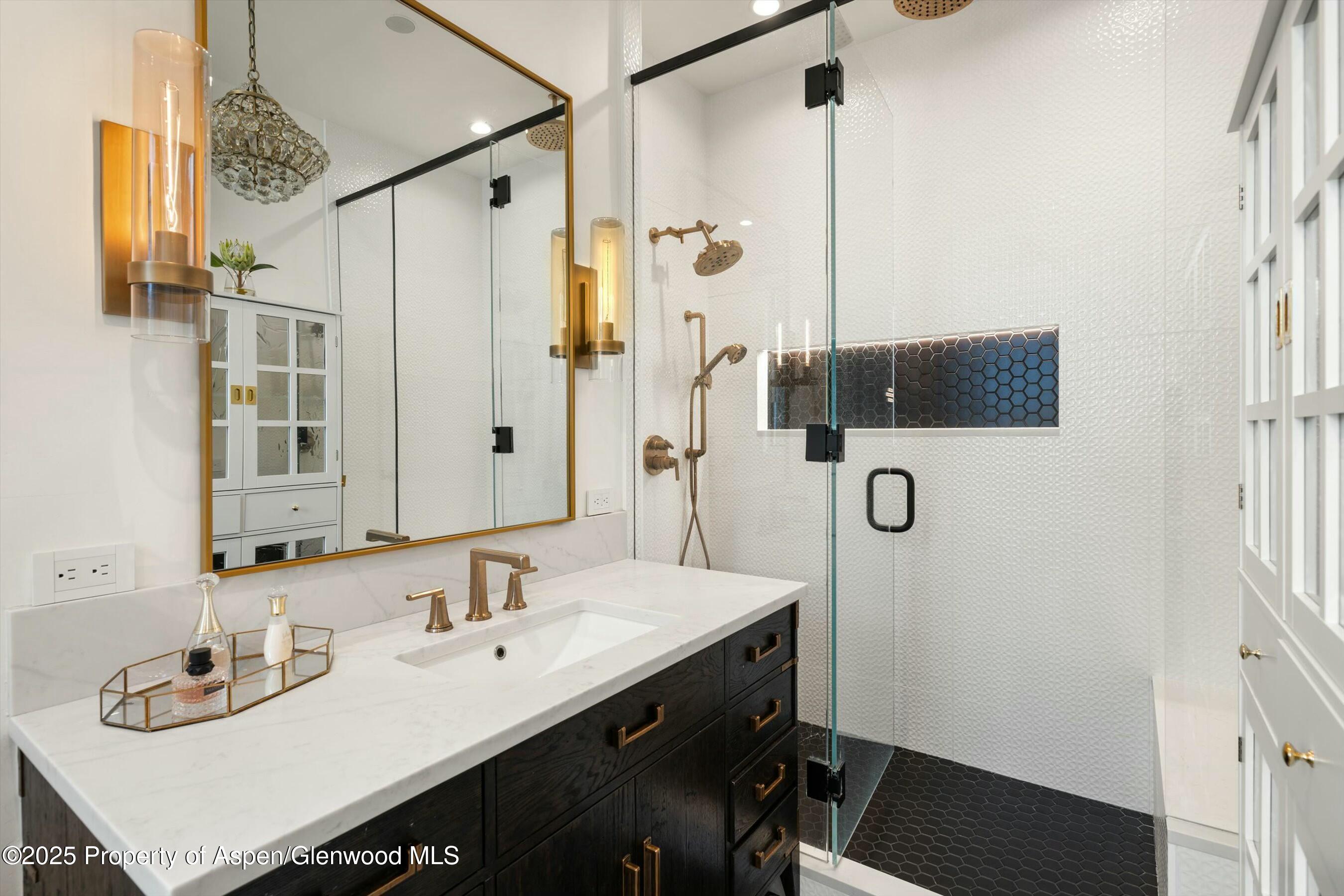 1631 Emma Spur Basalt, CO 81621 - Photo 25 of 52 a bathroom with a sink double vanity and a mirror