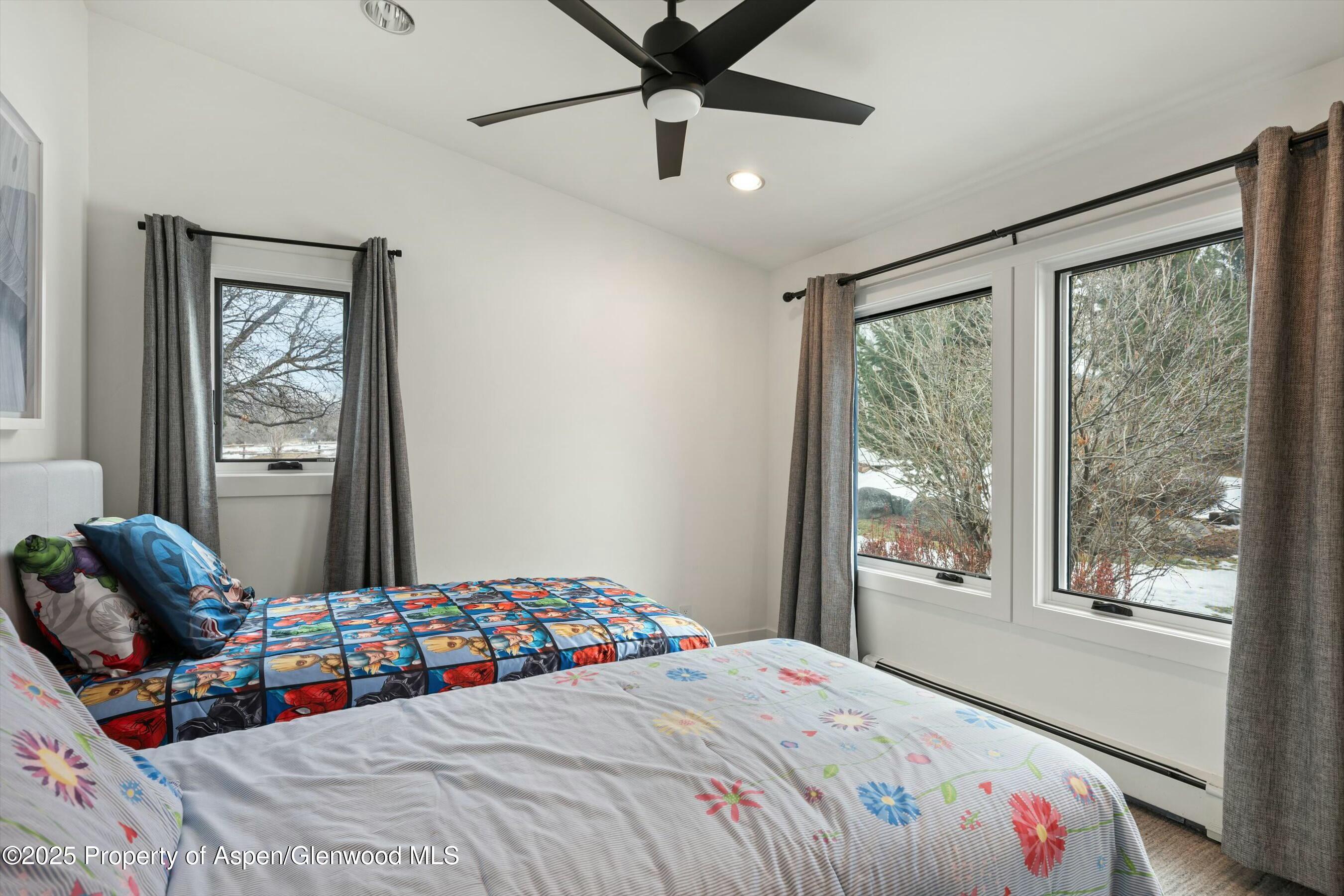 1631 Emma Spur Basalt, CO 81621 - Photo 26 of 52 a bedroom with a bed and a window