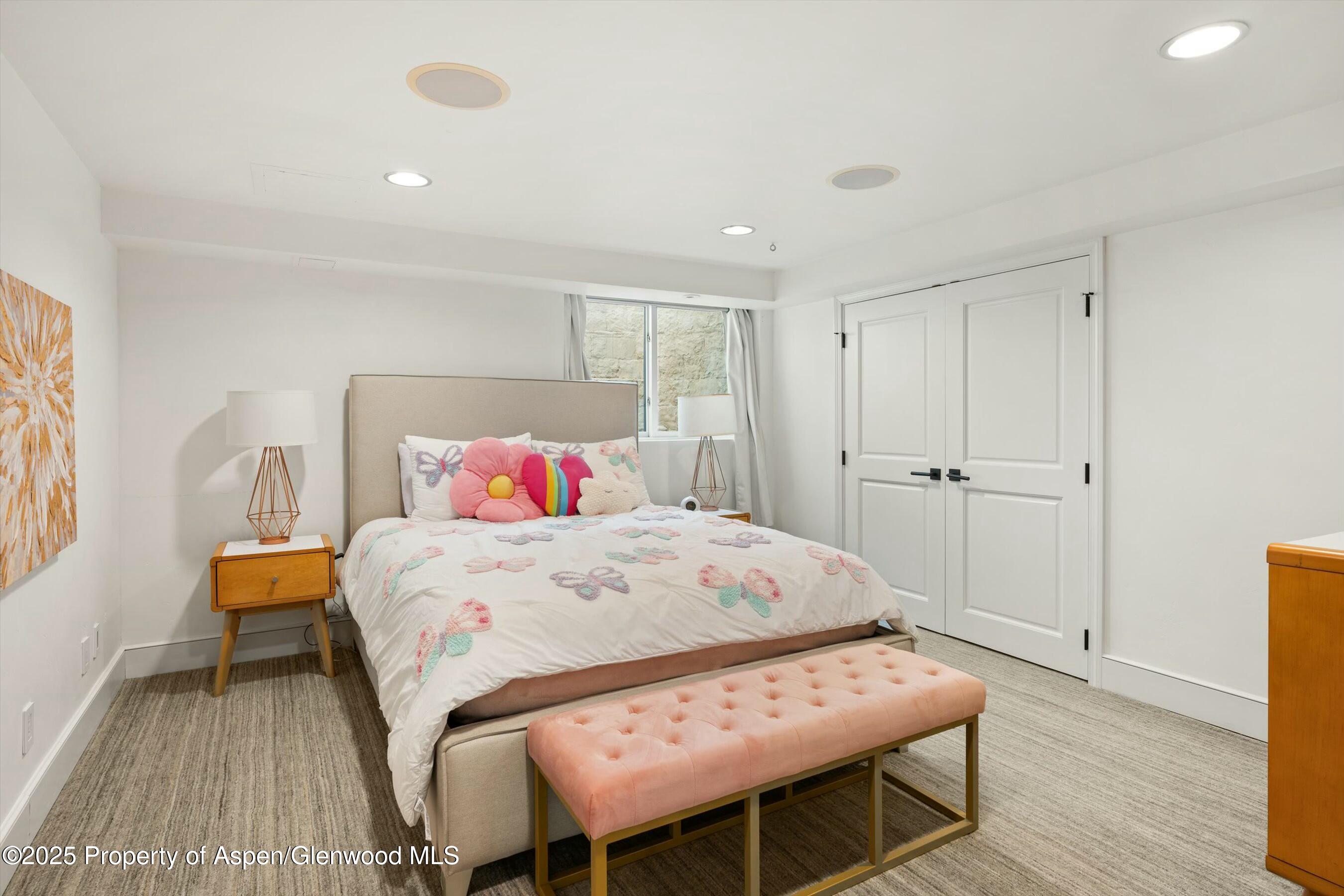 1631 Emma Spur Basalt, CO 81621 - Photo 30 of 52 a bedroom with a bed and wooden floor