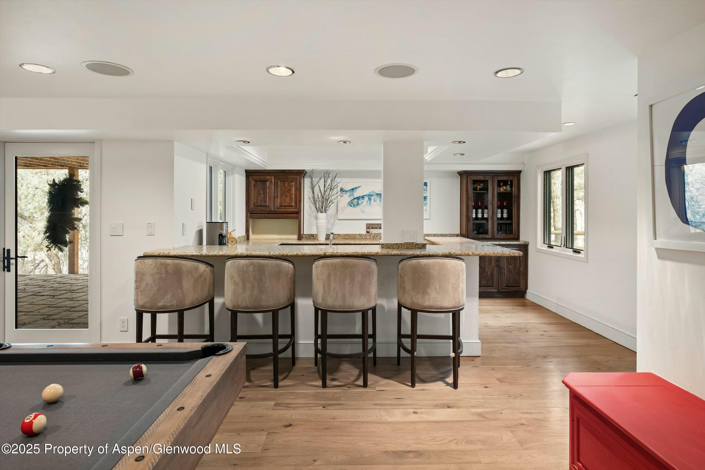 1631 Emma Spur Basalt, CO 81621 - Photo 32 of 52 a living room with lots of furniture and kitchen view